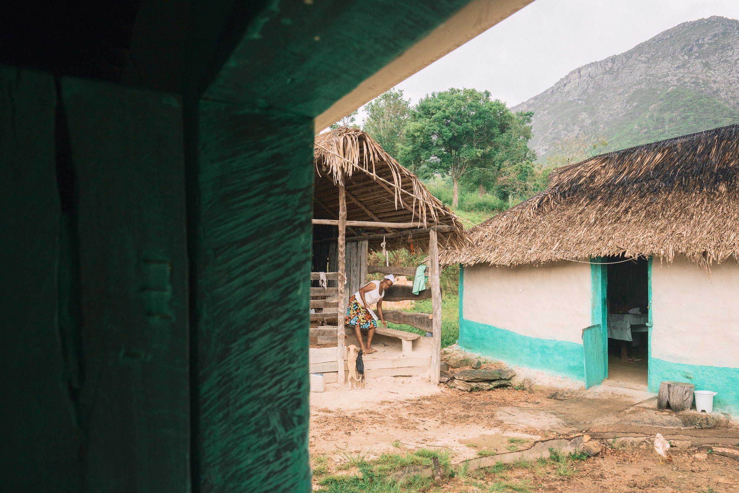 Dona Maria and her dogs at her home in Bica d'Agua, Serra do Espinhaço