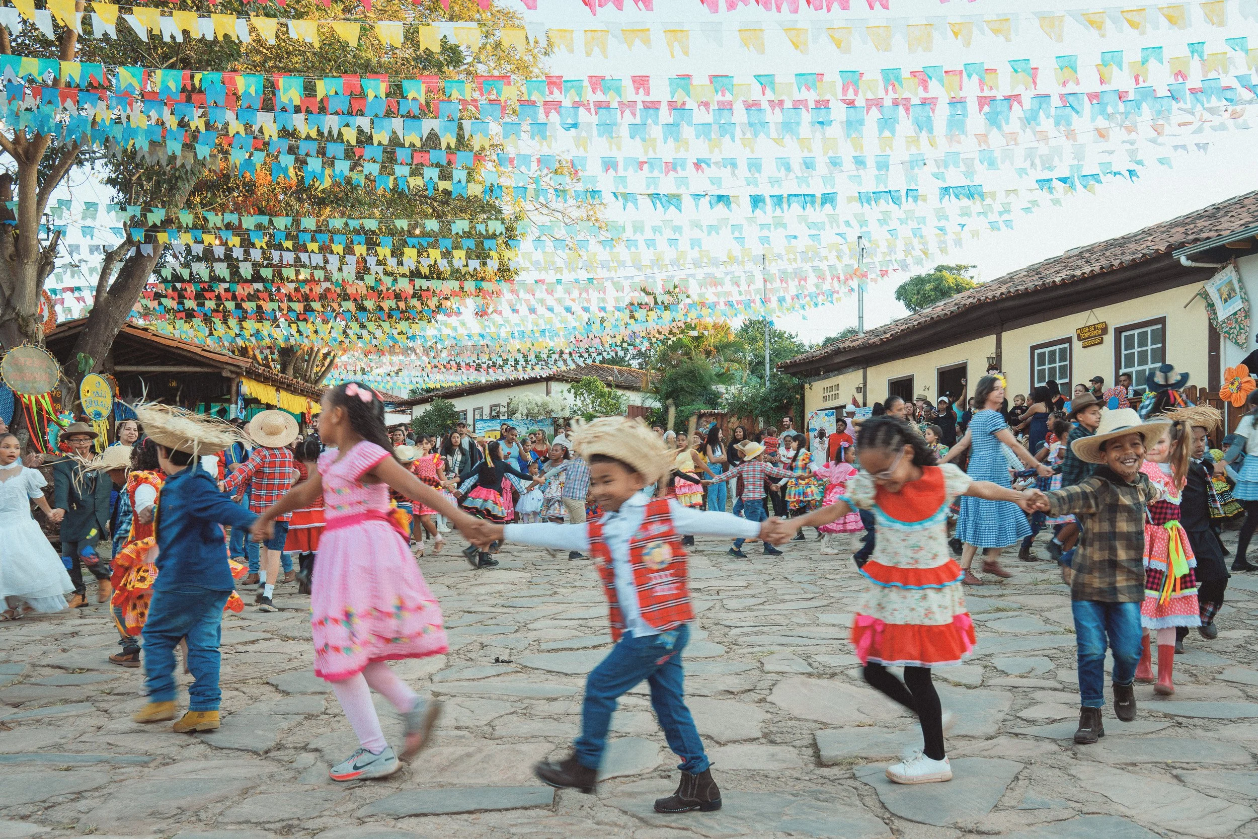 Local children dancing a quadrilha in the streets of downtown São Gonçalo do Rio das Pedras, Minas Gerais