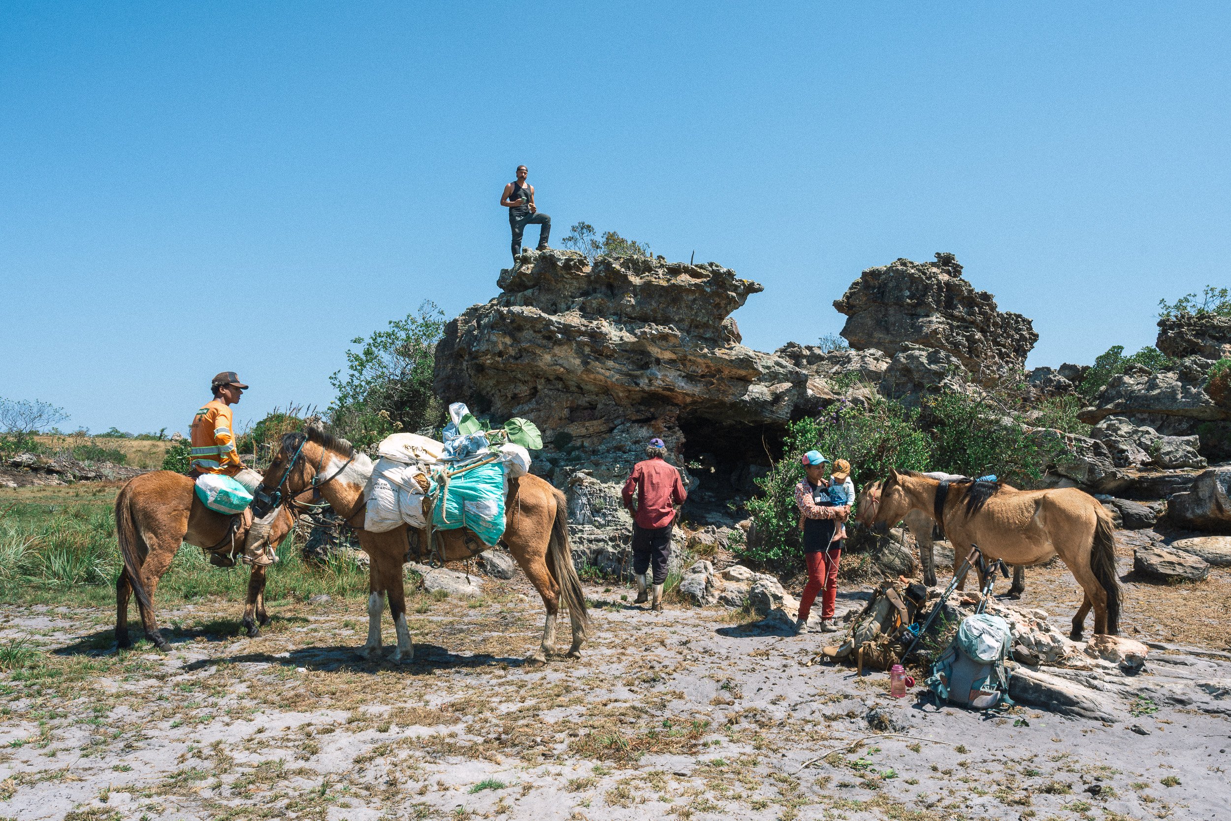 Members of Alves’s family and their horses and pack animals at their rocky cave near Campos Tristes in Sempre Vivas National Park.