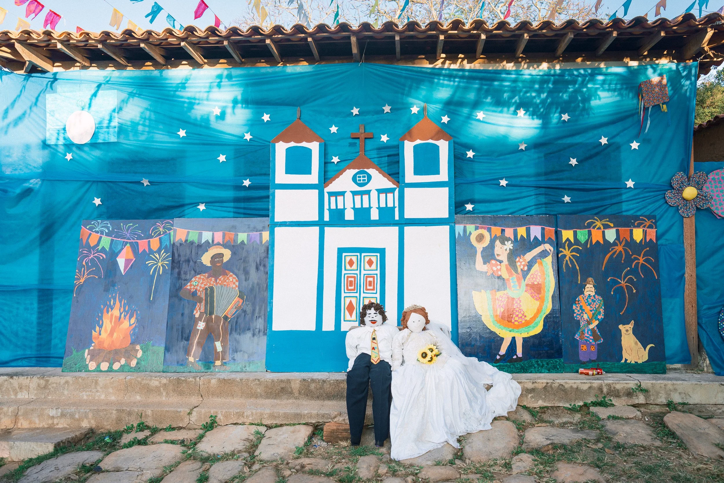 A colorful mural adorns a home in downtown São Gonçalo do Rio das Pedras during a festa junina