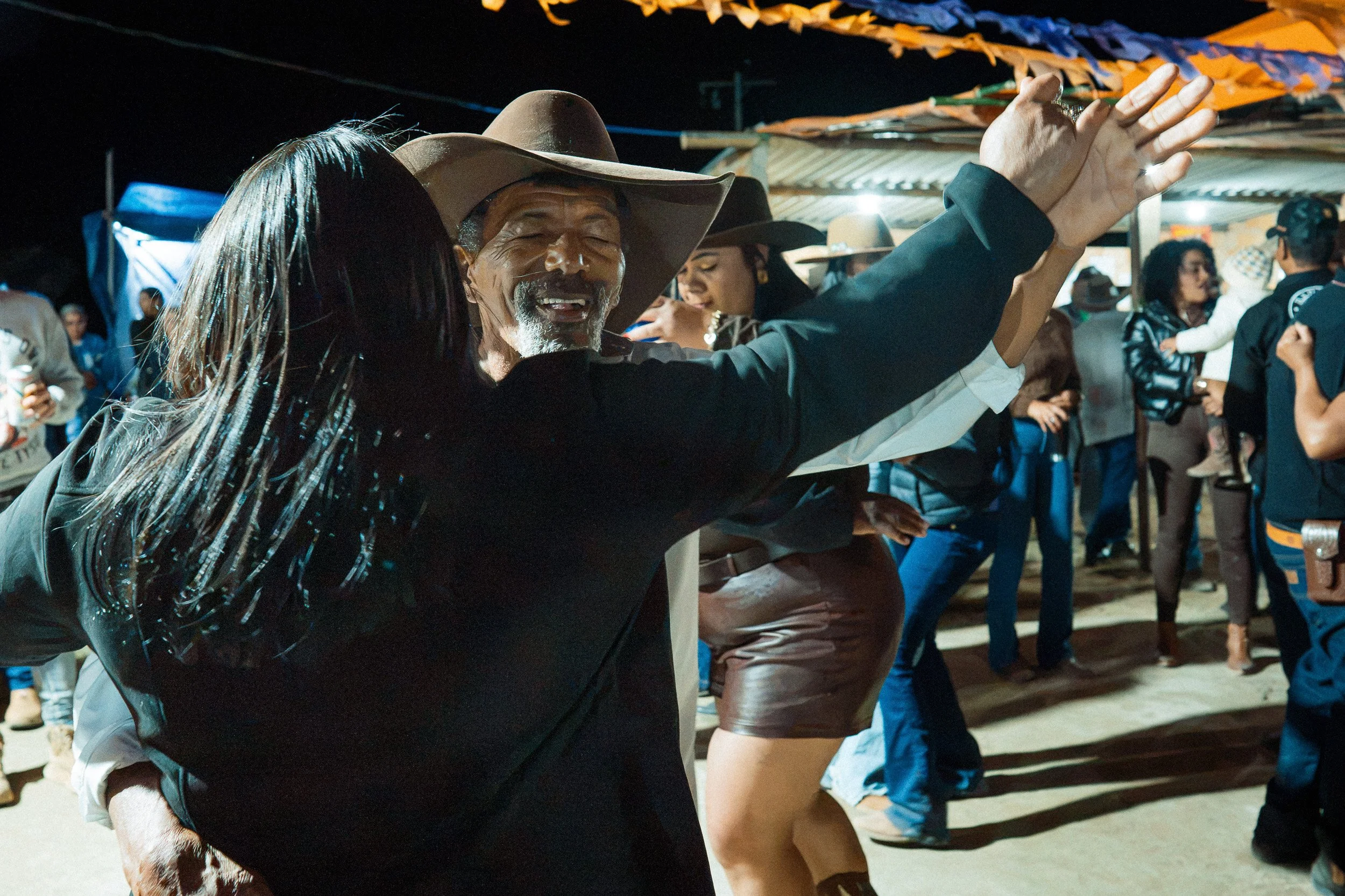 A couple dancing to forró music at a party in Santa Rita, Serra do Espinhaço