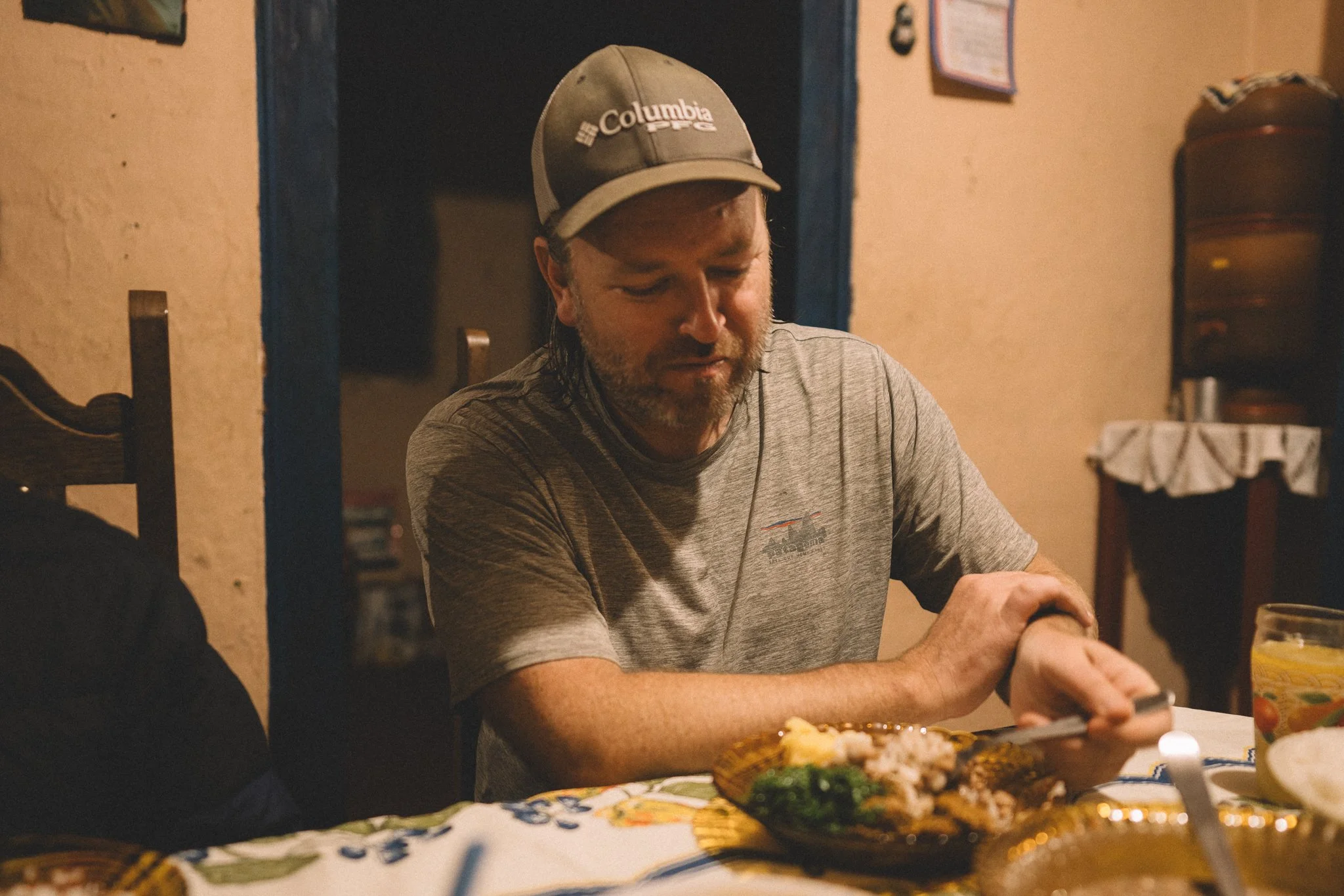 Neil having dinner at Poliana's house in Quartel do Indaiá, Serra do Espinhaço