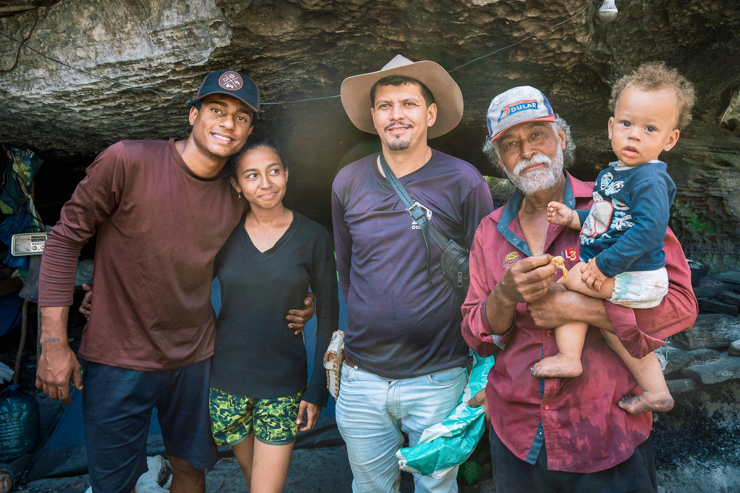 Alves and his family with Guim at their rock shelter near Campos Tristes in the Serra do Espinhaço.