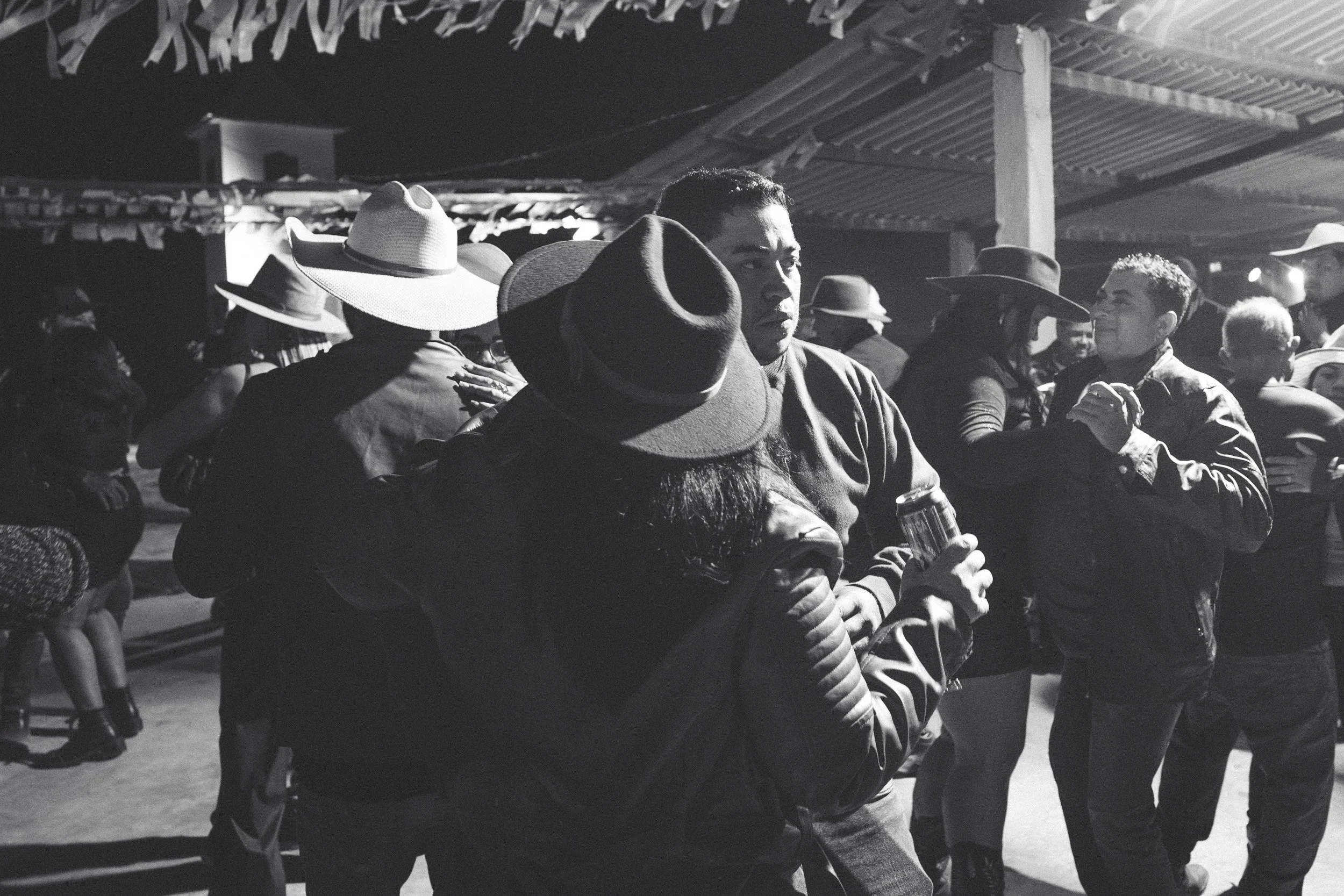 A couple slow-dancing at a party in Santa Rita, Serra do Espinhaço