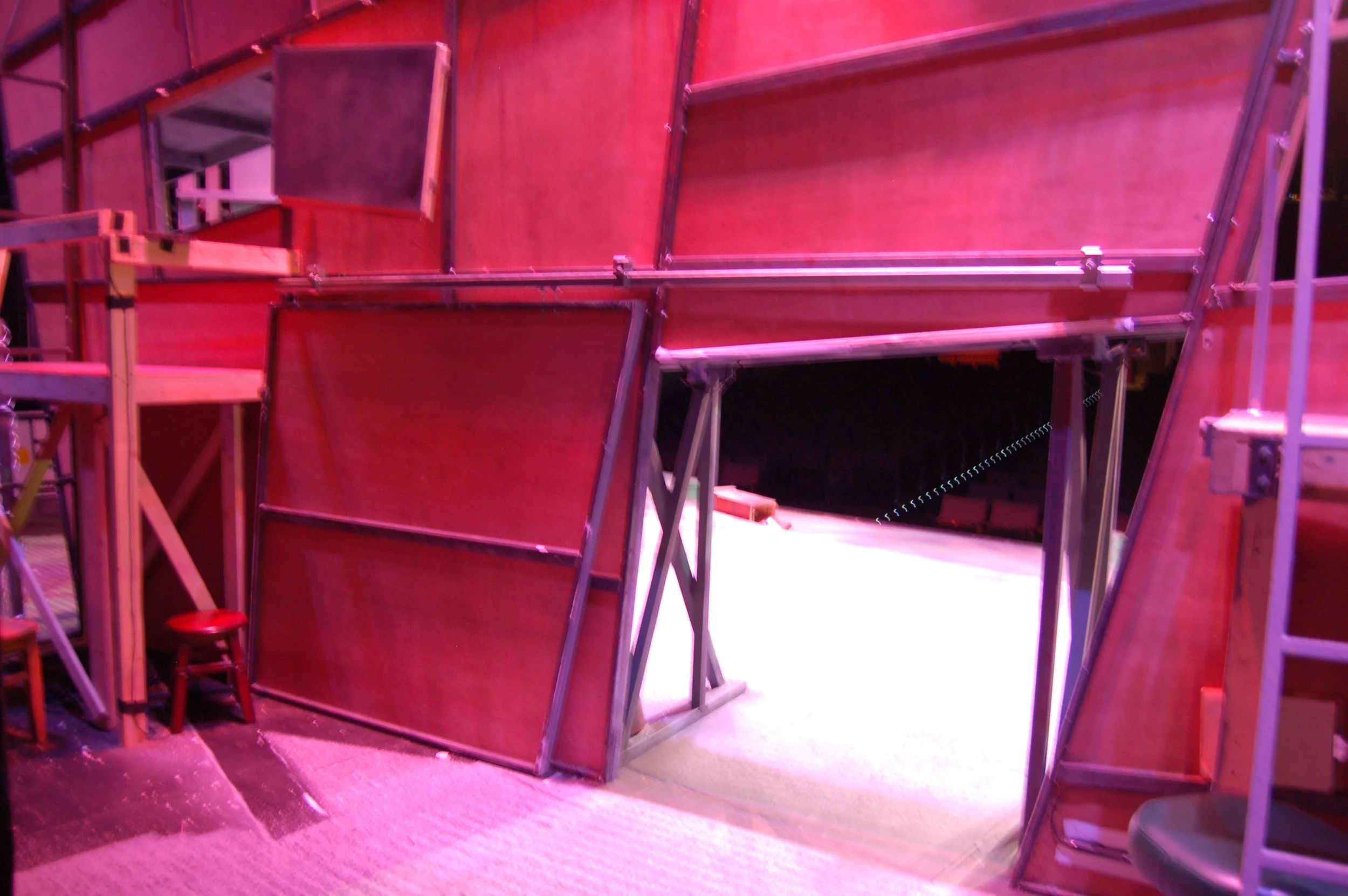 Lower sliding door, with view of an additional window opening on the second level.