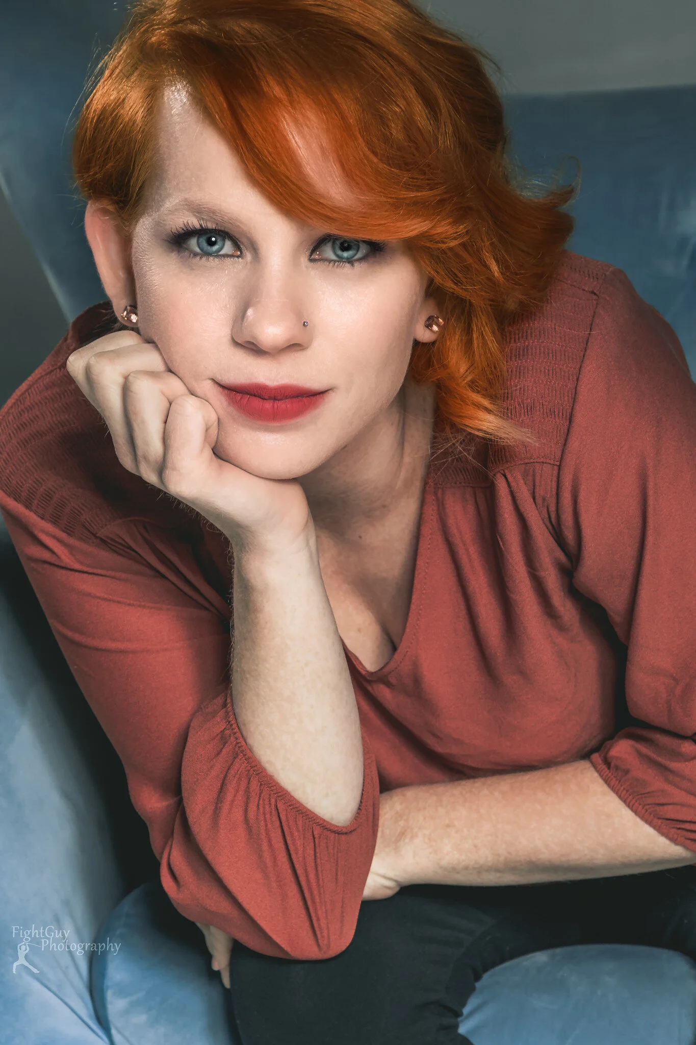 Portrait of a redhead in an orange shirt