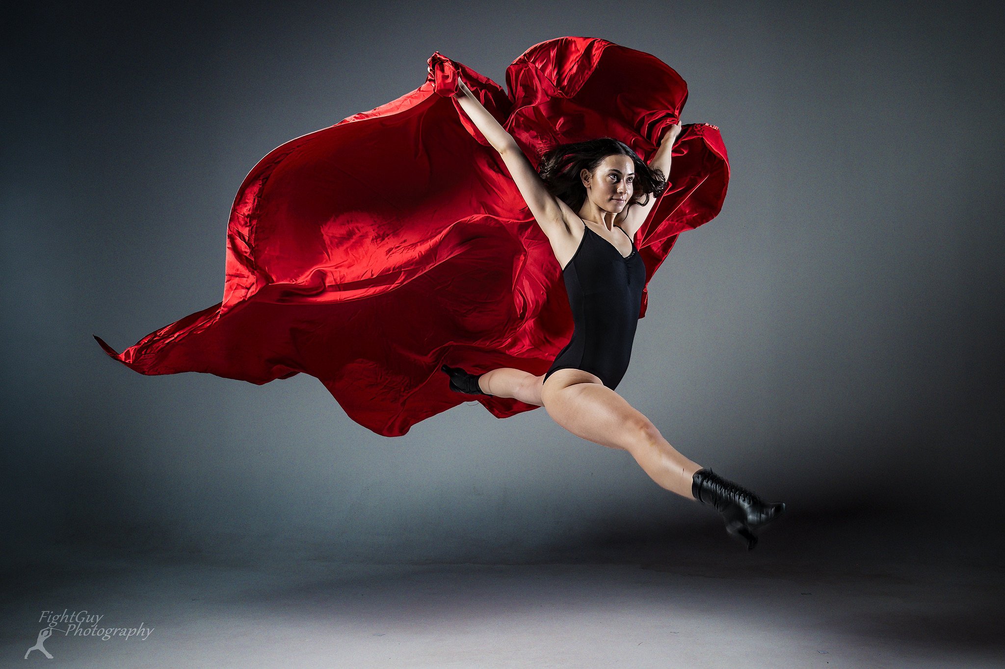 Dancer Kayla Walsh leaping in the studio