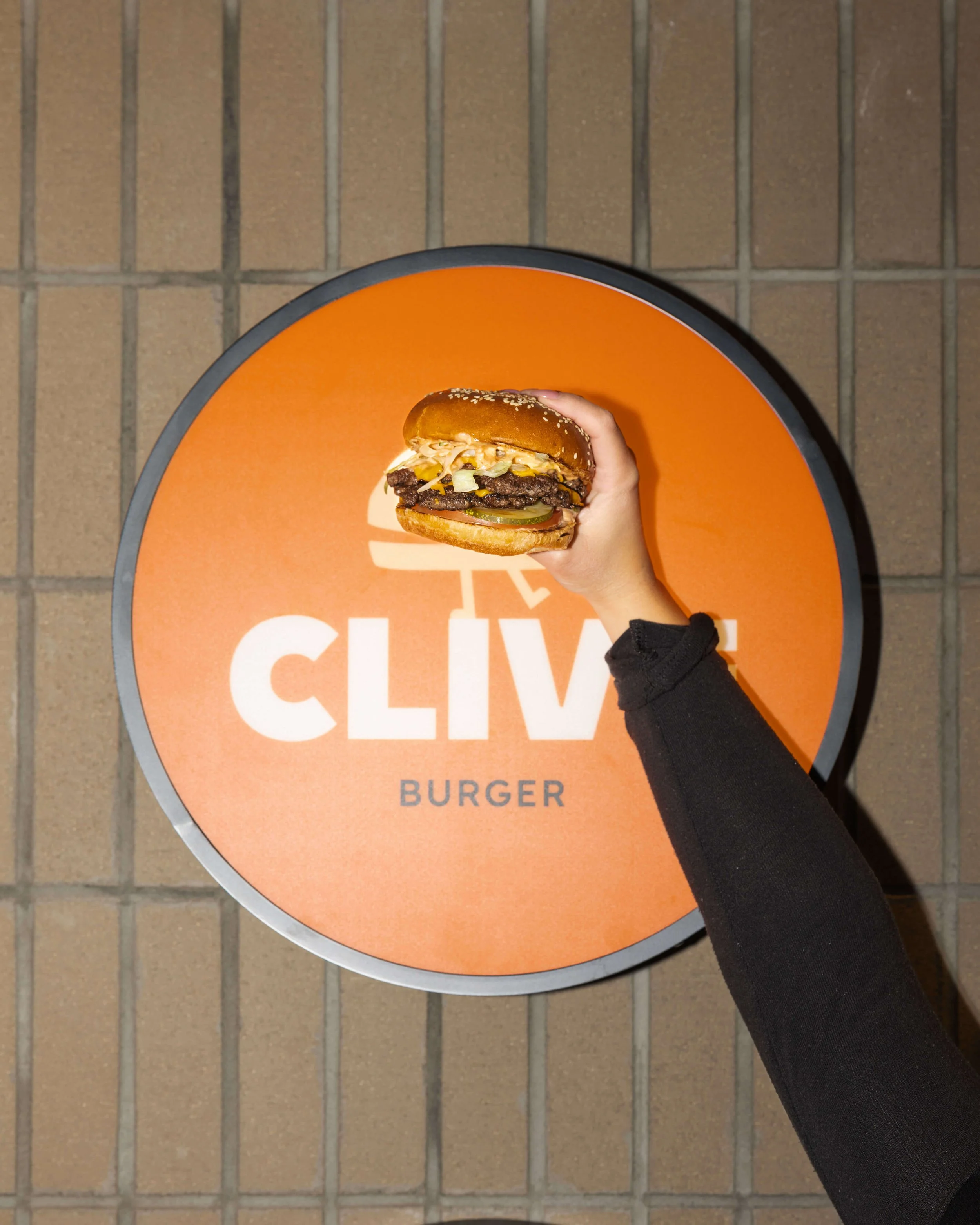 HoldingBurger.jpg