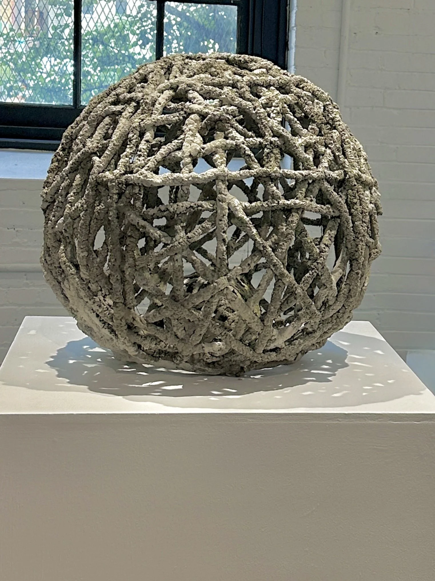 Large String Sphere in cement. 