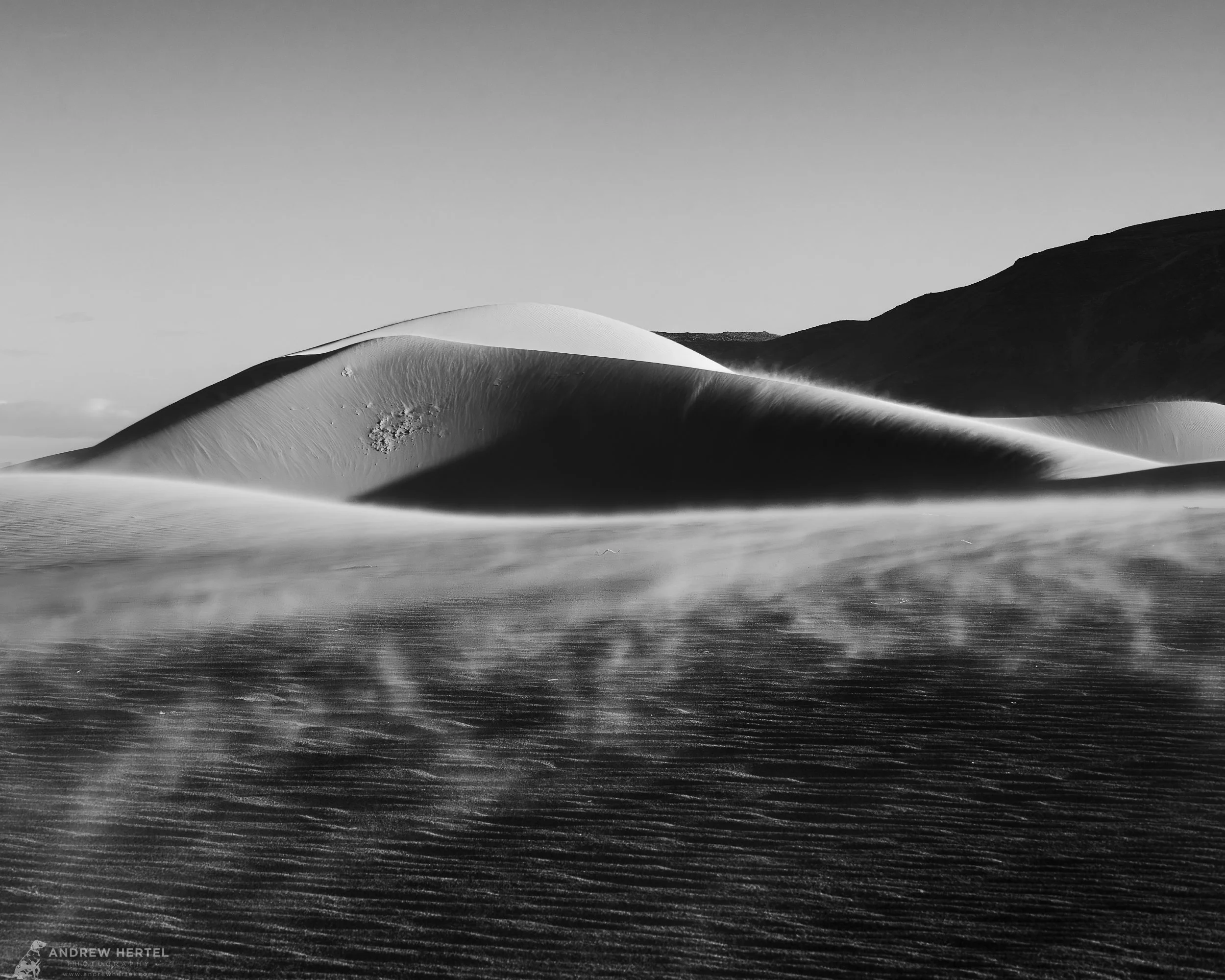 Black and white fine art photograph of sand dunes at Ibex Dunes in Death Valley National Park.