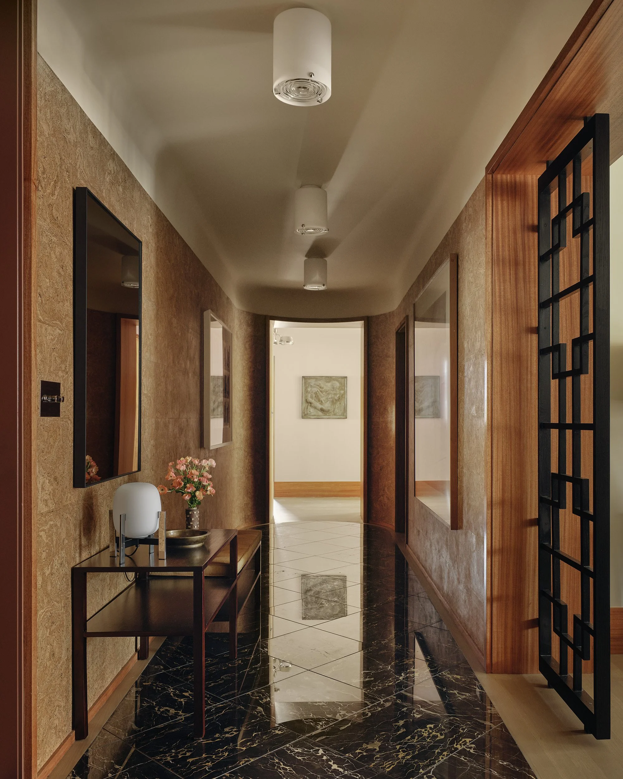 Foyer in with cork walls and a portoro marble floor designed by Nicholas Potts