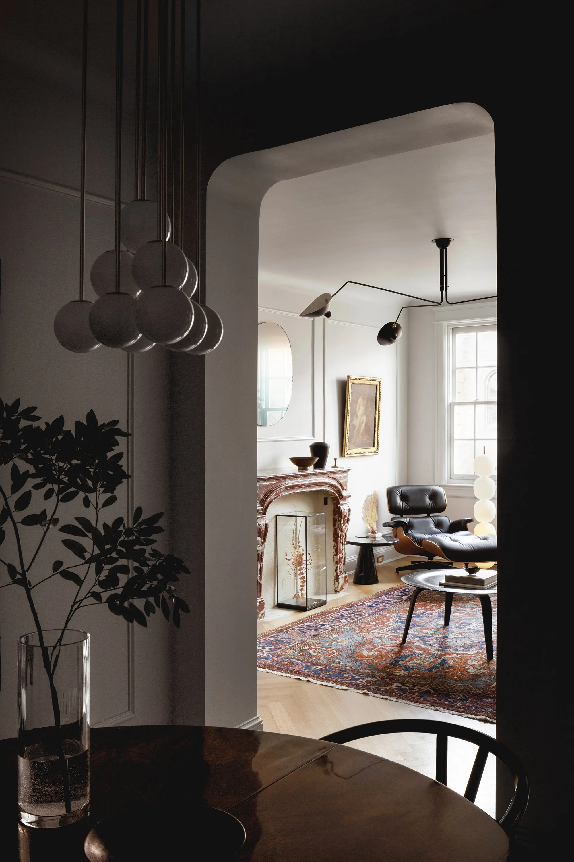 An arched opening in an apartment designed by Architect Nicholas Potts