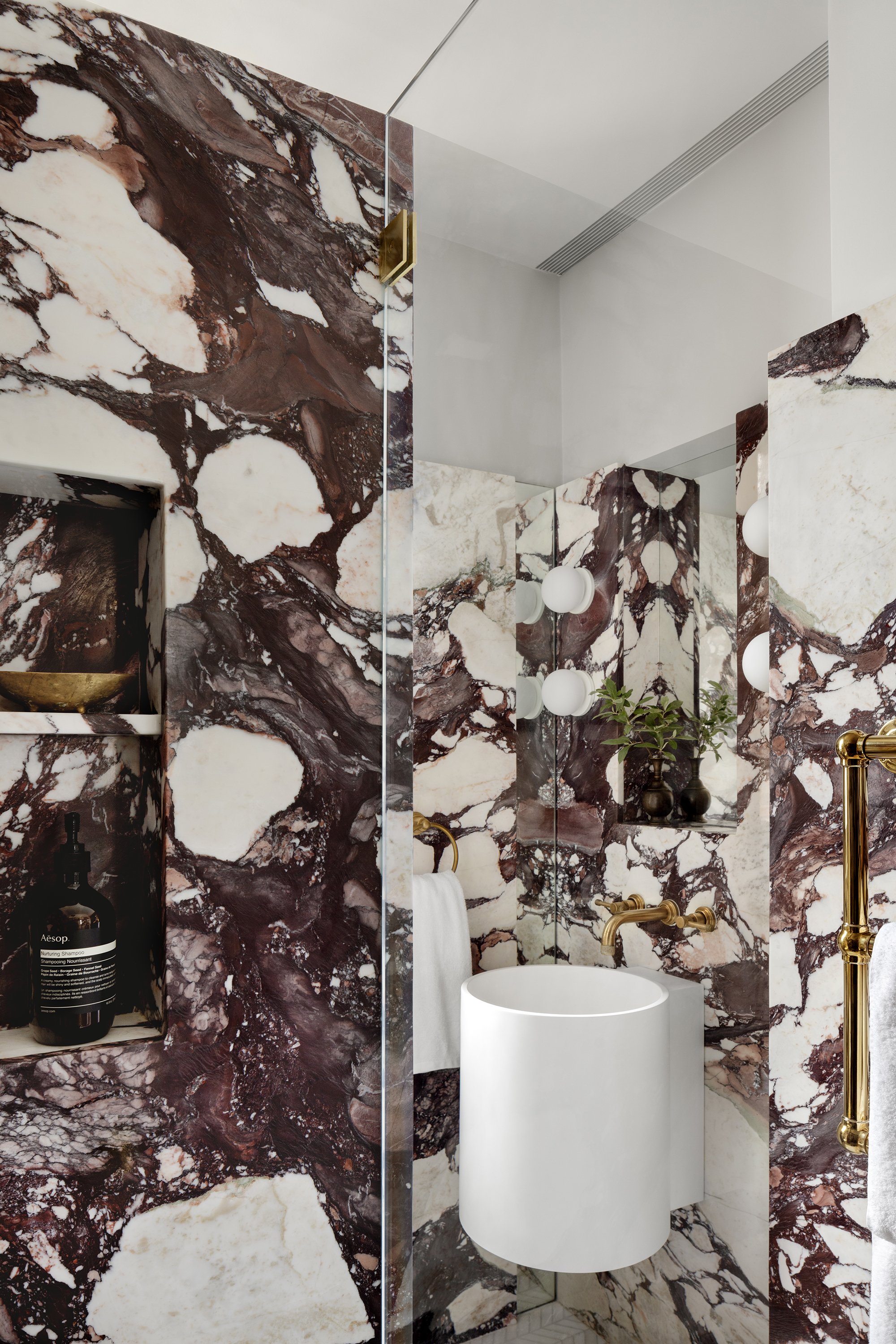 A calacatta viola marble bathroom designed by architect Nicholas Potts