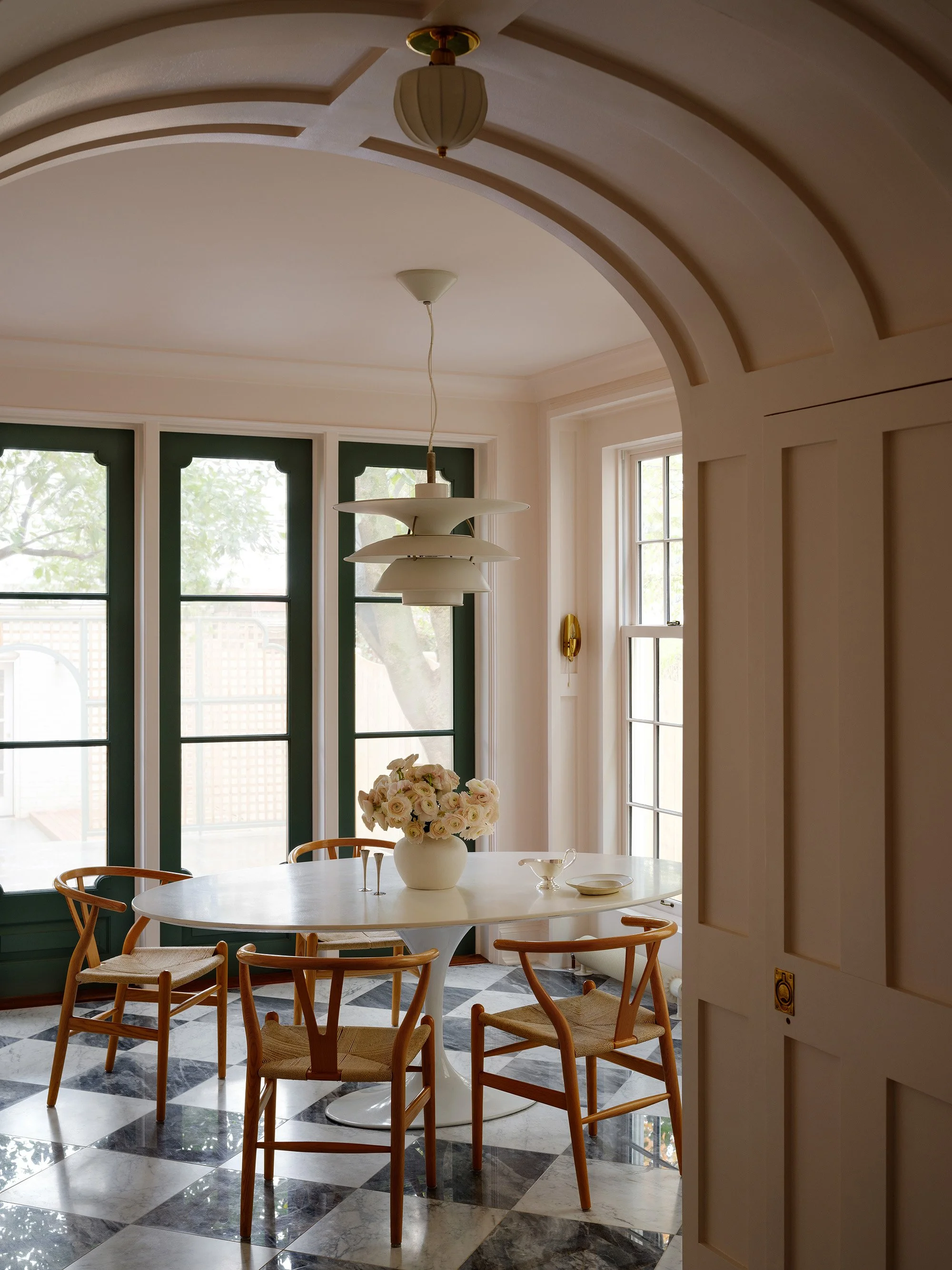 An archway and breakfast room in an historic row house in Capitol Hill