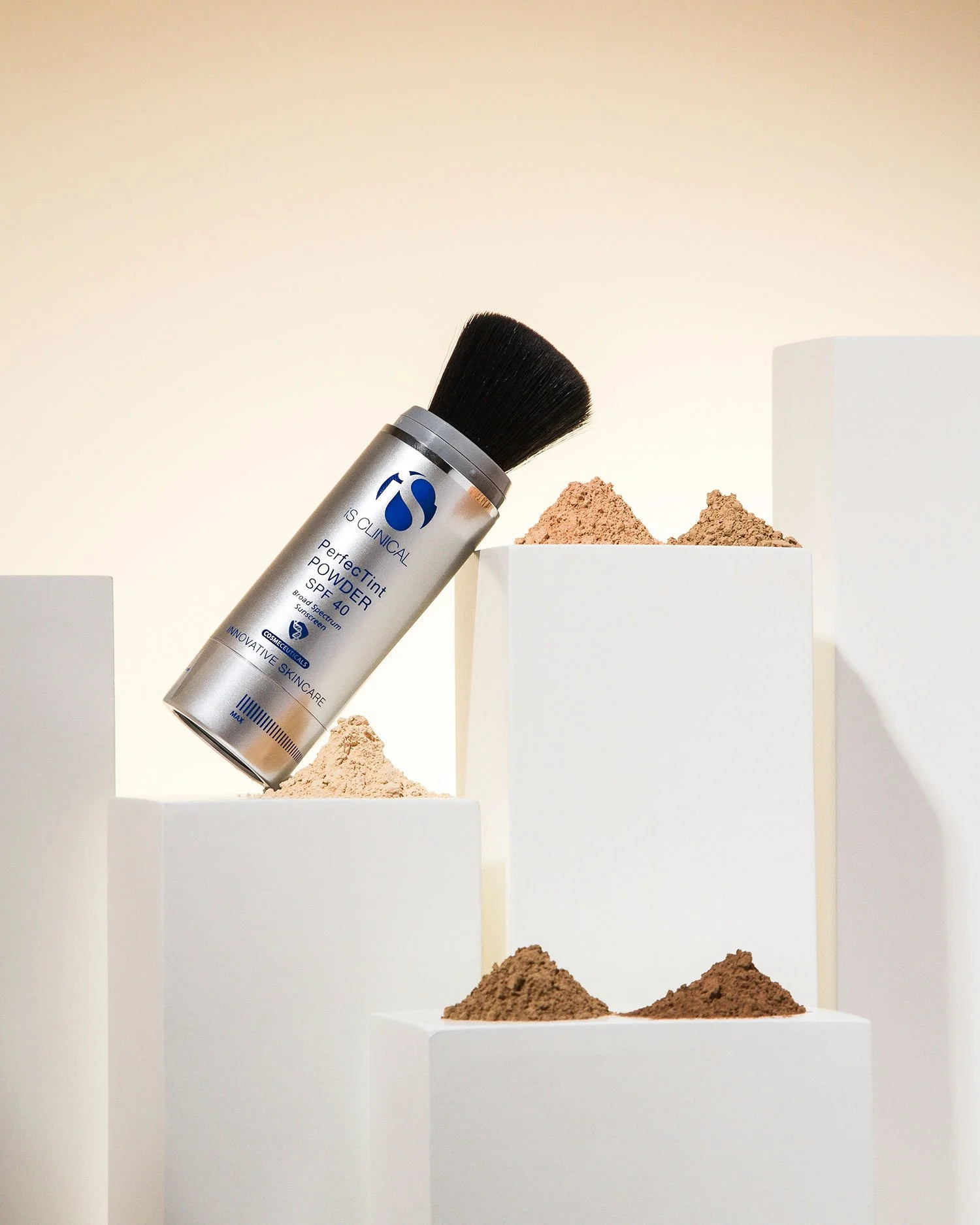 iS Clinical PerfecTint Powder SPF 40 brush – tinted mineral sunscreen and antioxidant protection by JBH Aesthetics Camden