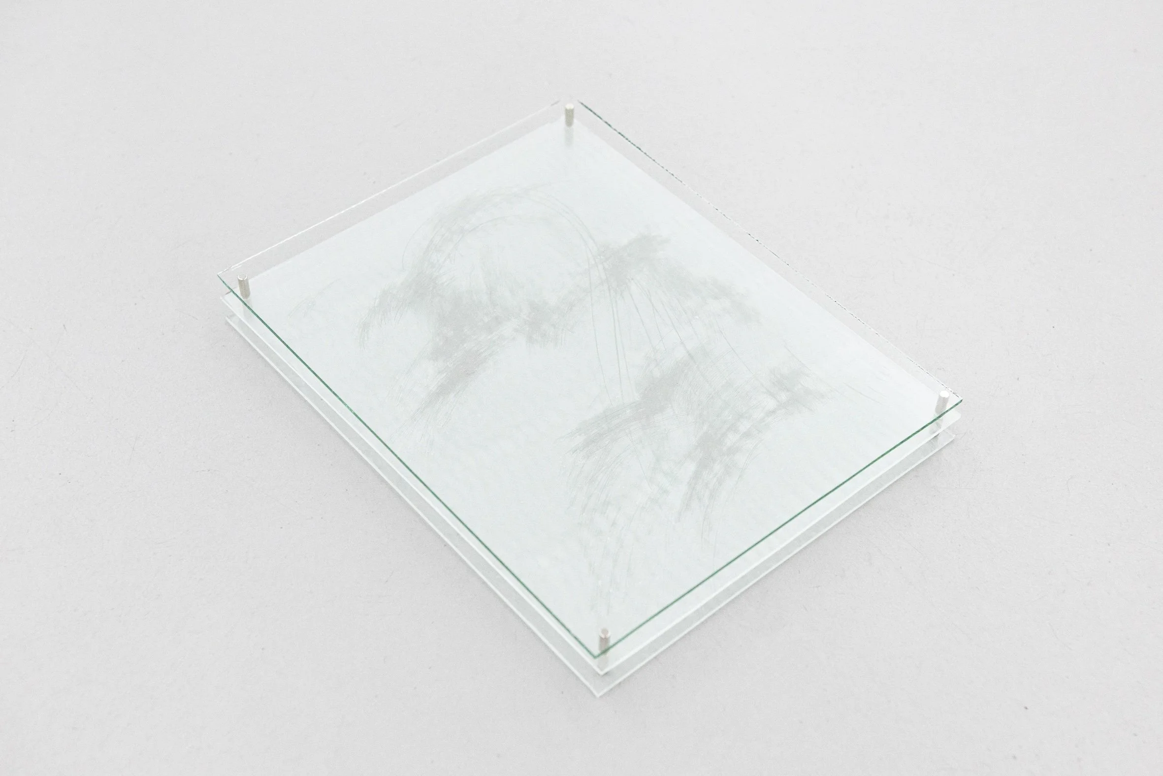 Untitled_glass, gesso, magnet_23 x 18 x 3cm, 2ea, 2025.jpg