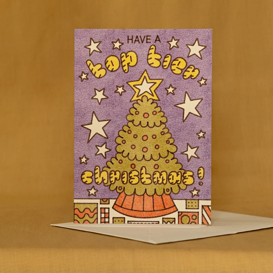  Have A Top Tier Christmas! 
A6 300gsm Christmas card with matching off-white envelope.

 SKU:  RW18 XMAS TIER
 WHOLESALE:  £8.40 per 6 unit pack (£1.40 per unit).
 RRP:  £3.00 per unit.