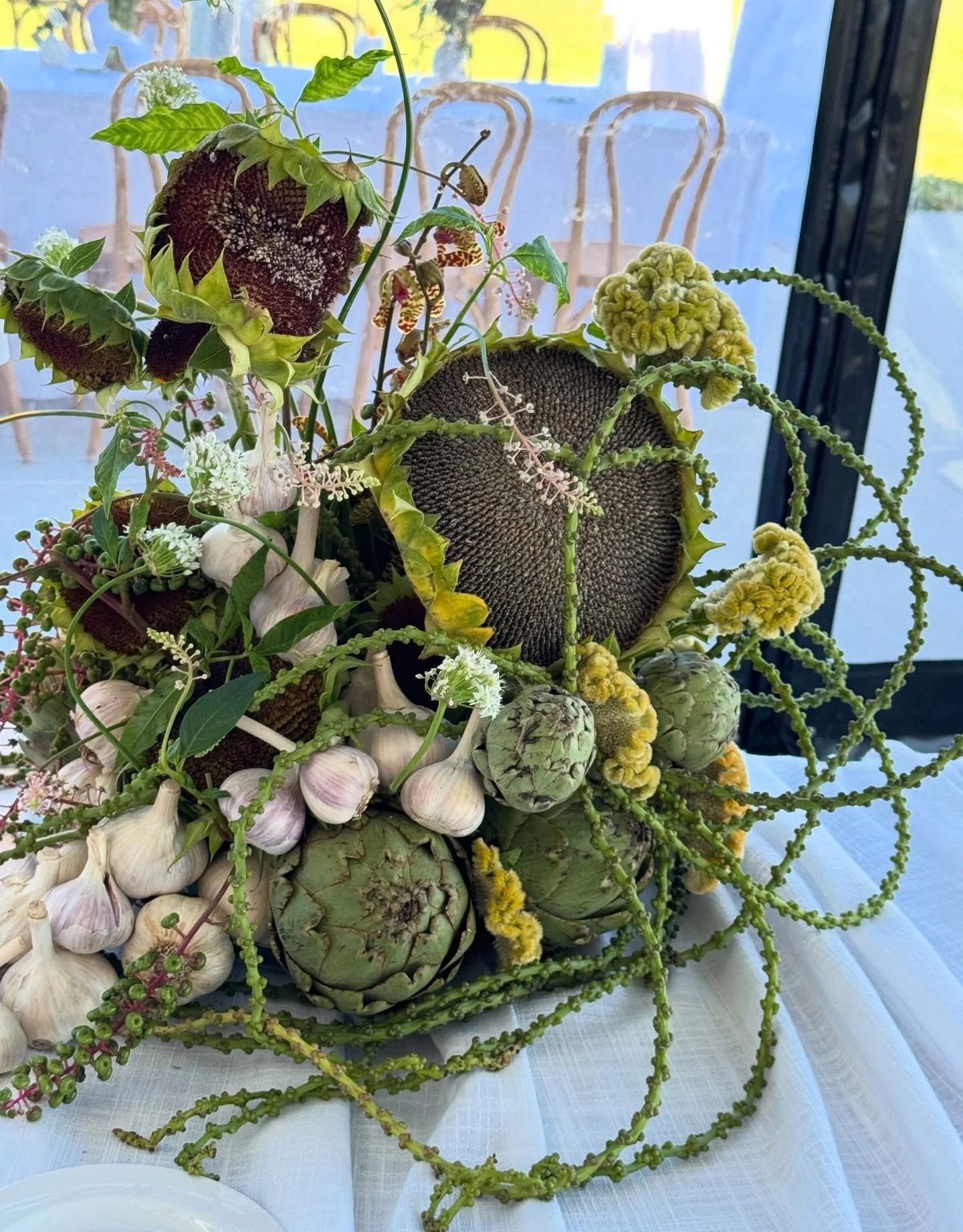 Sunflower heads against soft lake air and edible touches nestled between blooms. The perfect welcome party playfulness for Ali and Gij. 🦪

#northernmichigan #northernmichiganwedding #welcomeparty