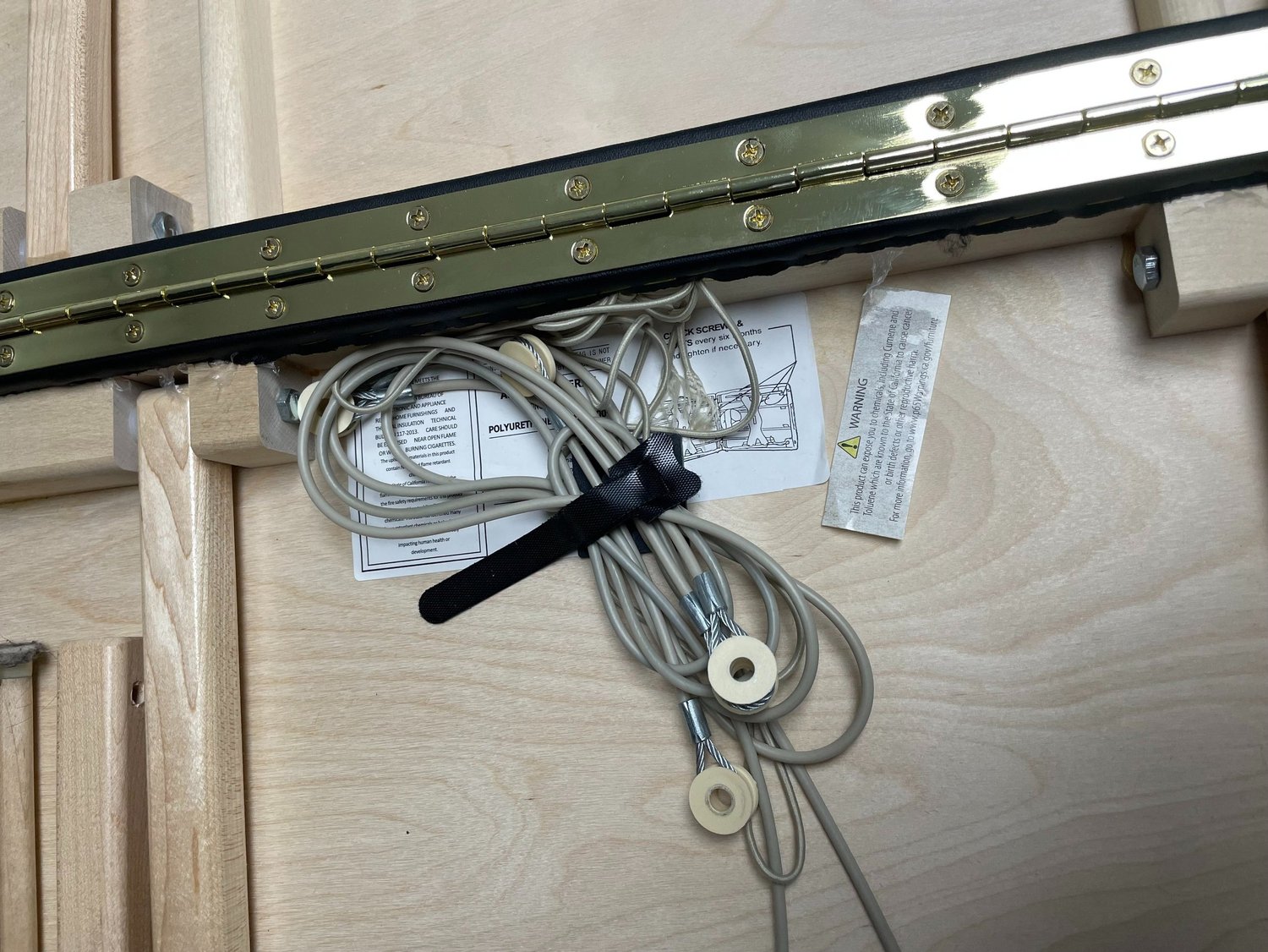 Golden hinge connecting both halves of massage table