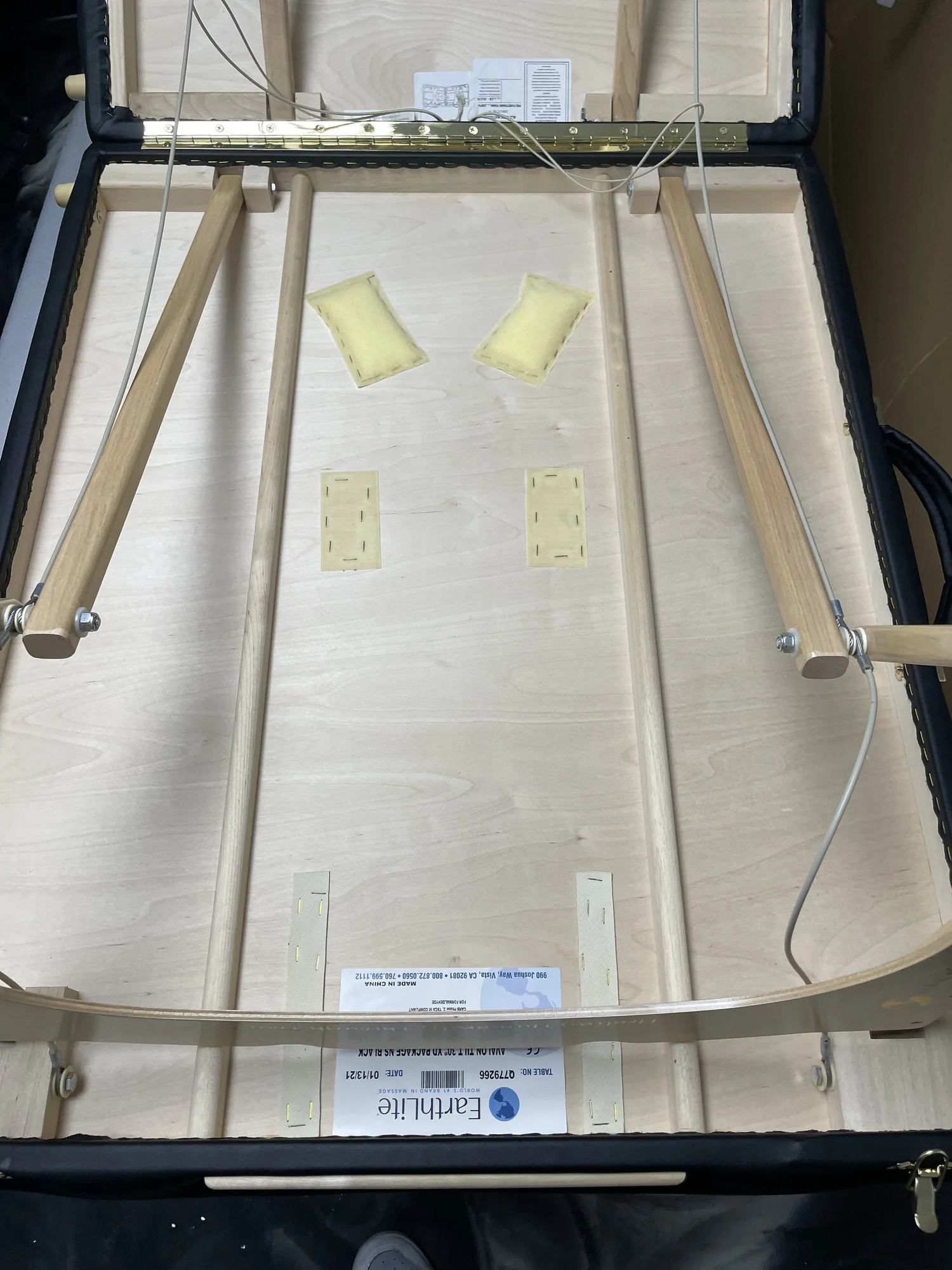 Wing nut and bolt closeup on massage table tether
