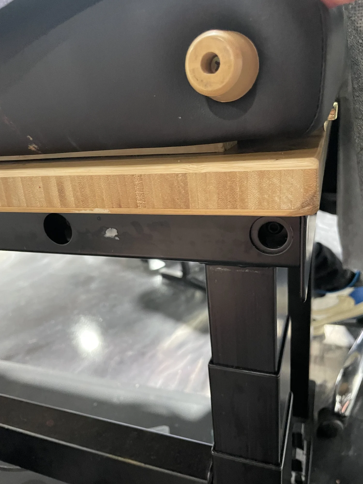 Hinge clearance verified between massage table frame and bamboo desktop