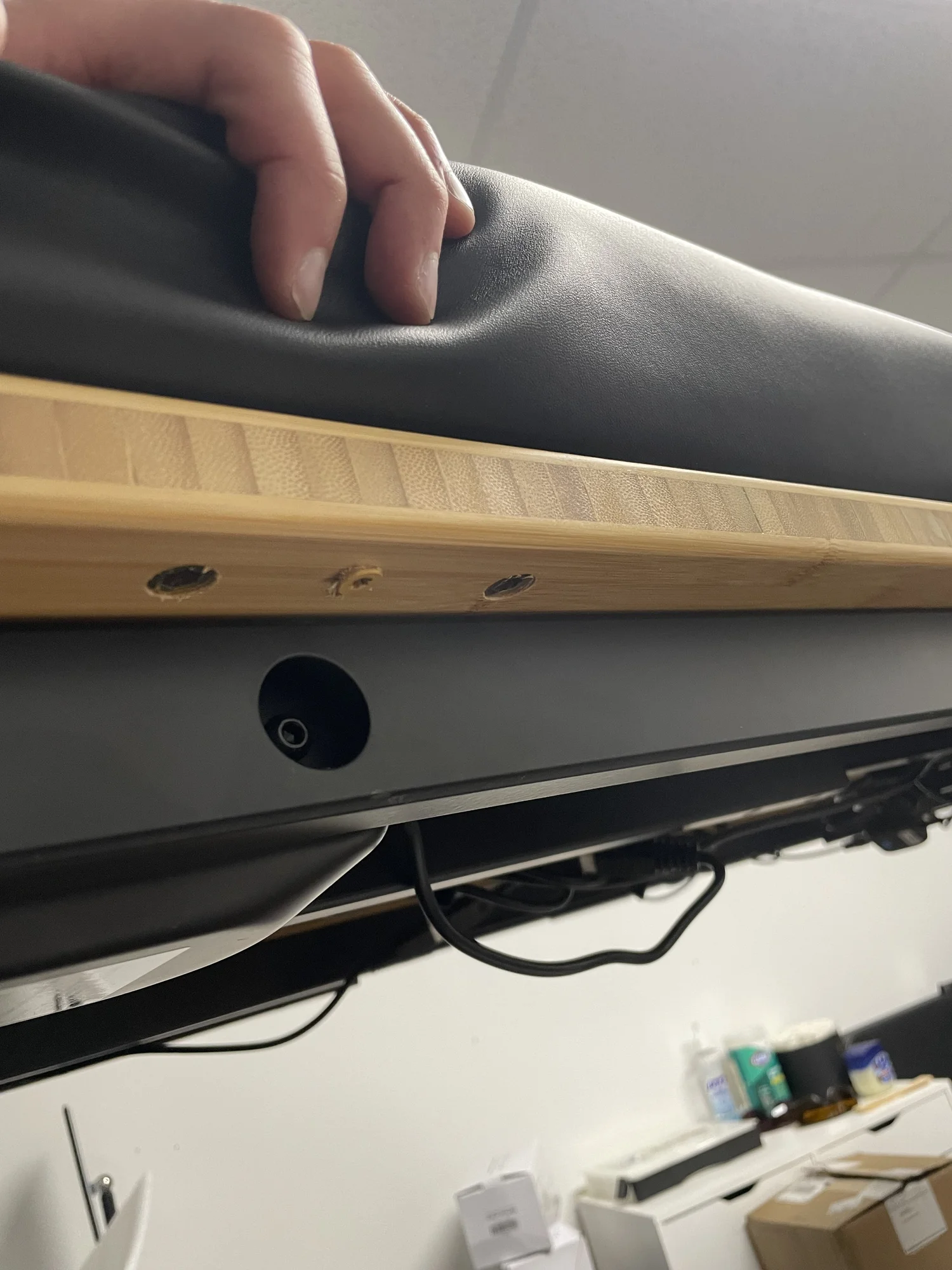 Completed screw attachment securing massage table to desk