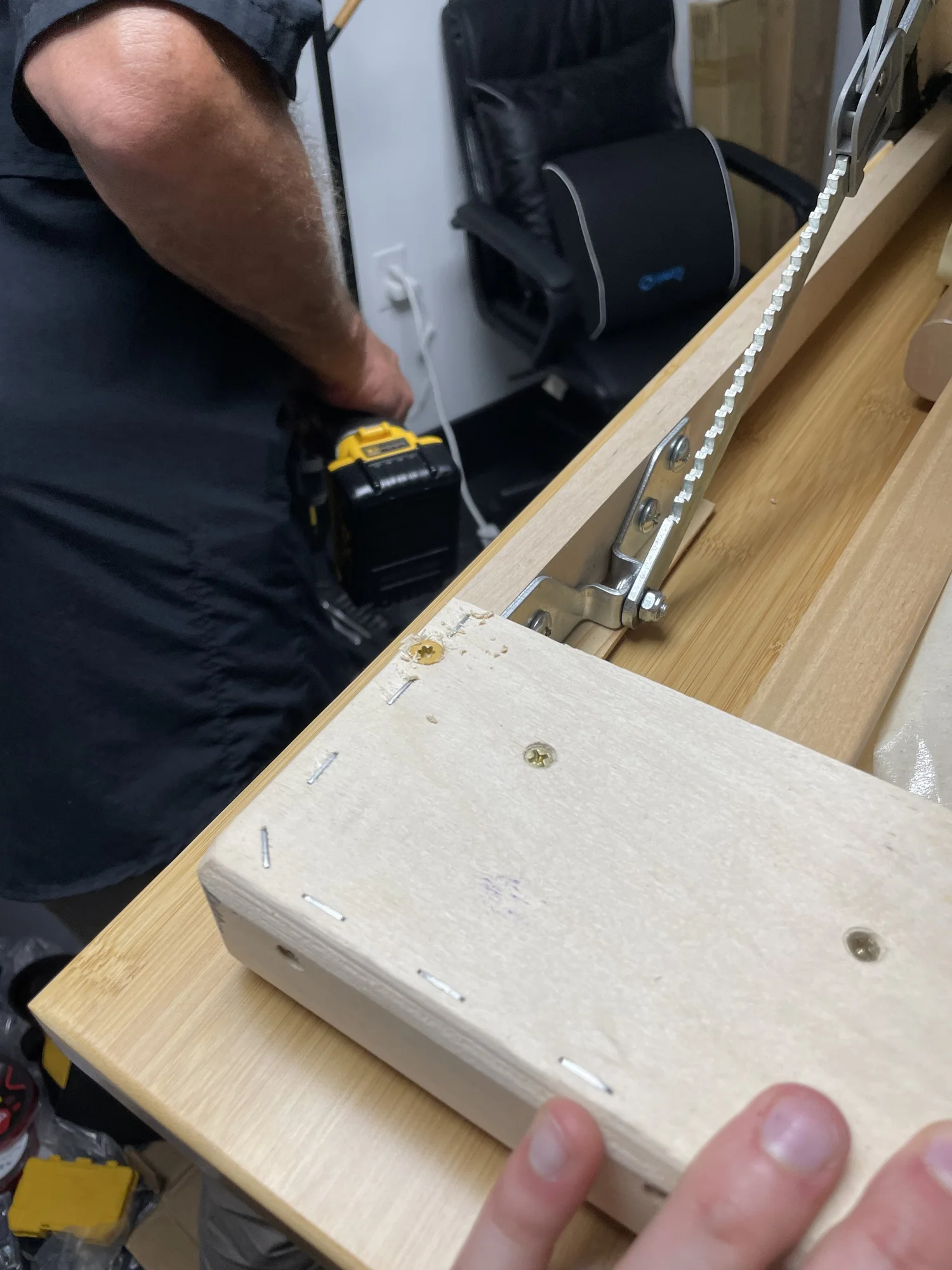 Both sides secured with screws through shims