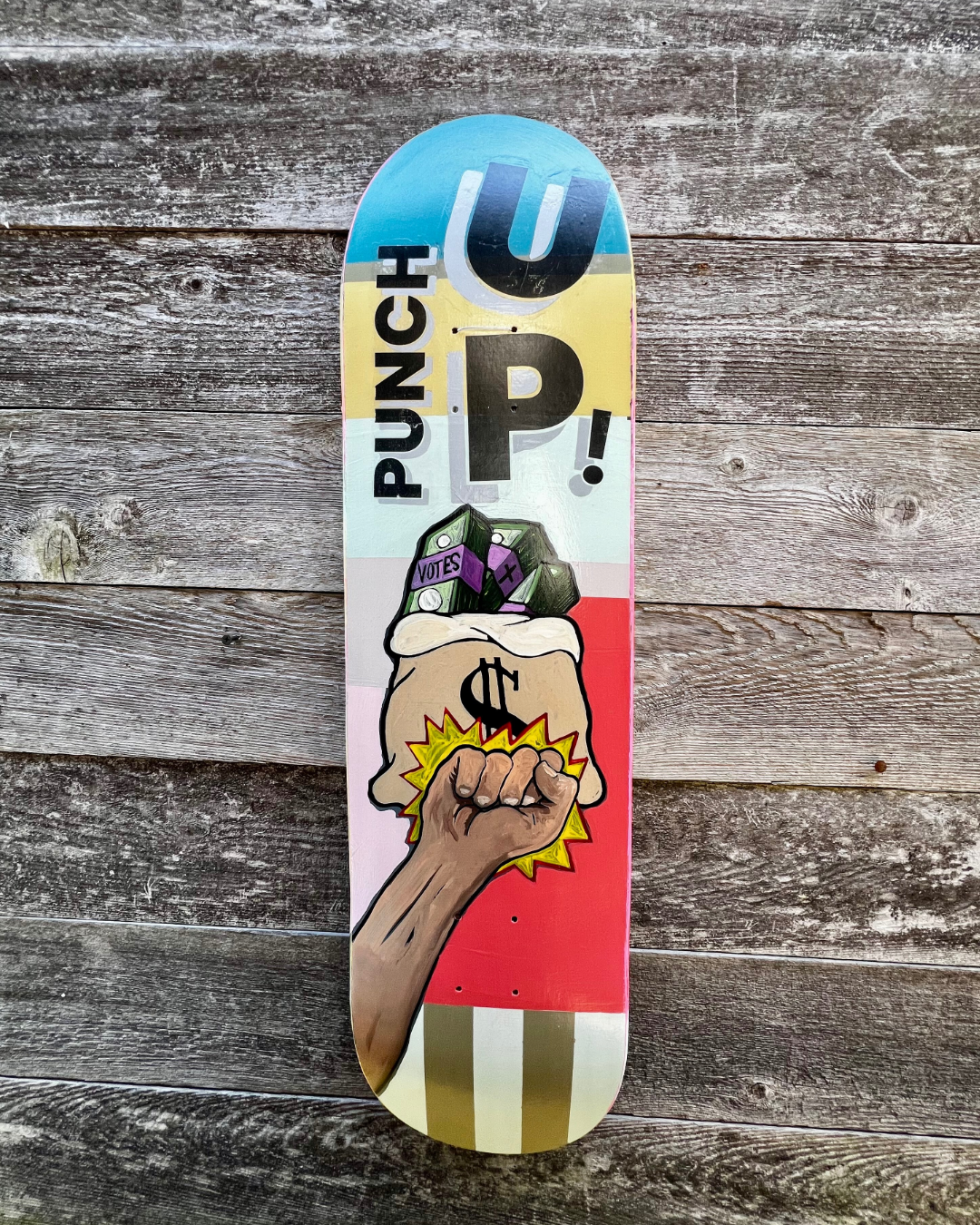 Punch Up, mixed media on skateboard by Hoey Xōchitl, Zandra X and Timothy Wilson Hoey, 8.5x32.5 inches, 2026