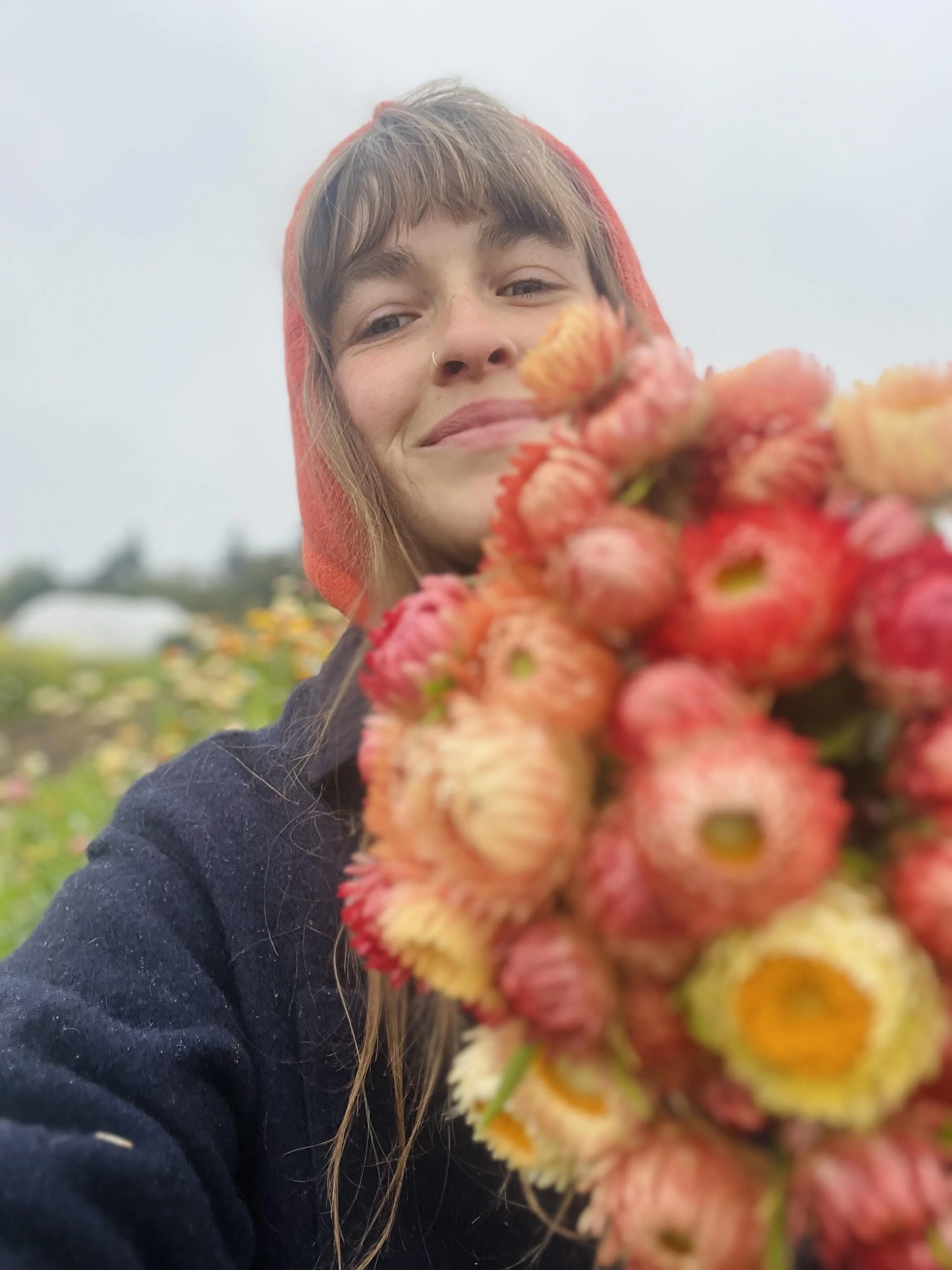 Kristen Murray of Rowdy Sprout Farm holding flowers