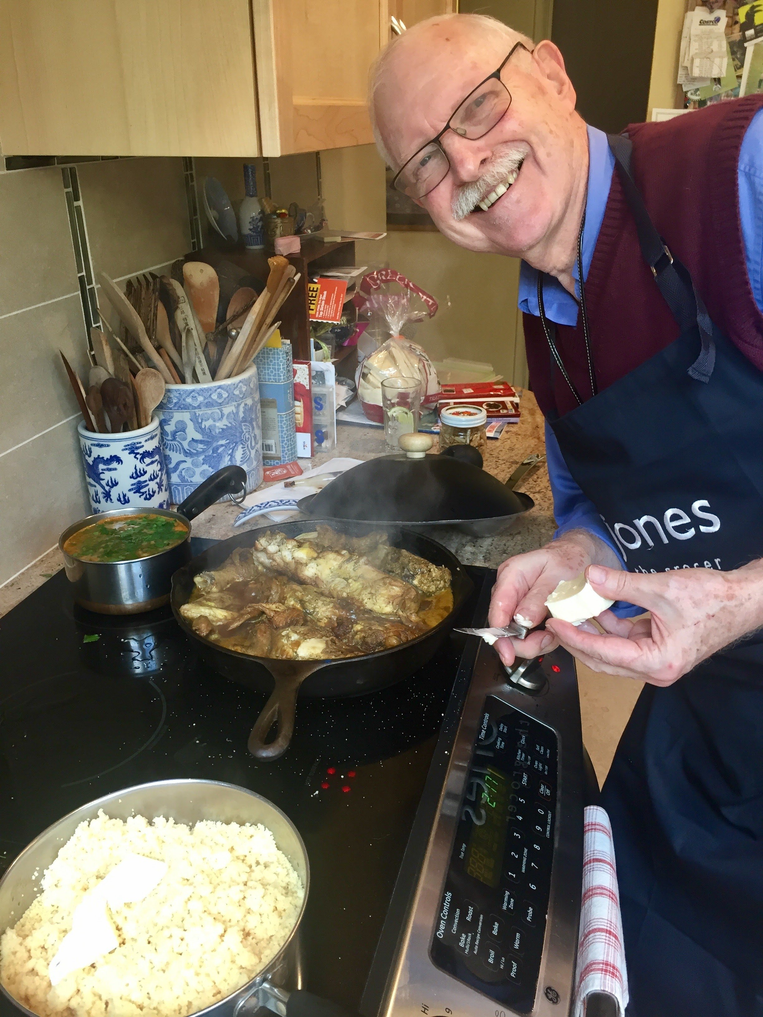 sarah's dad cooking over the stove