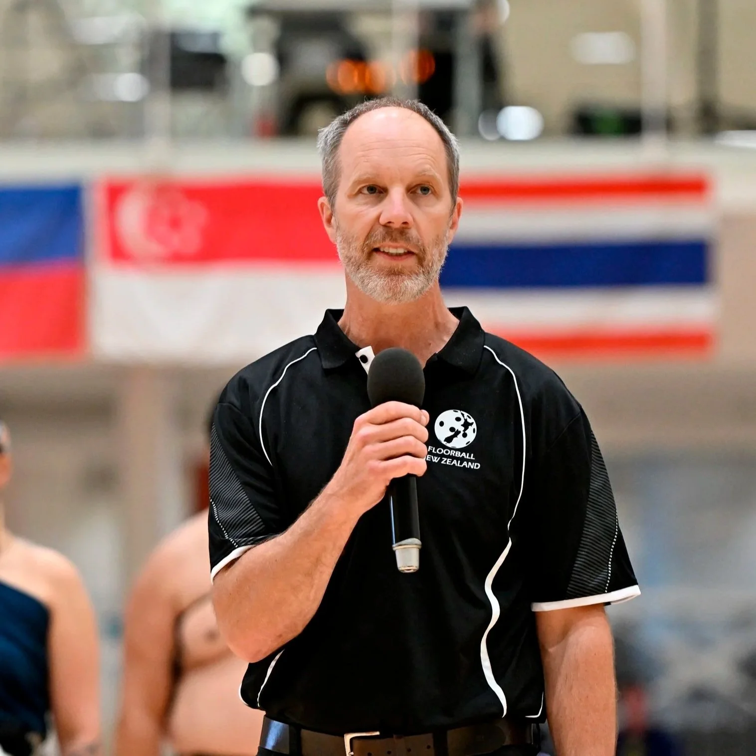 Graphic of the moon with text saying 'Floorball New Zealand' underneath