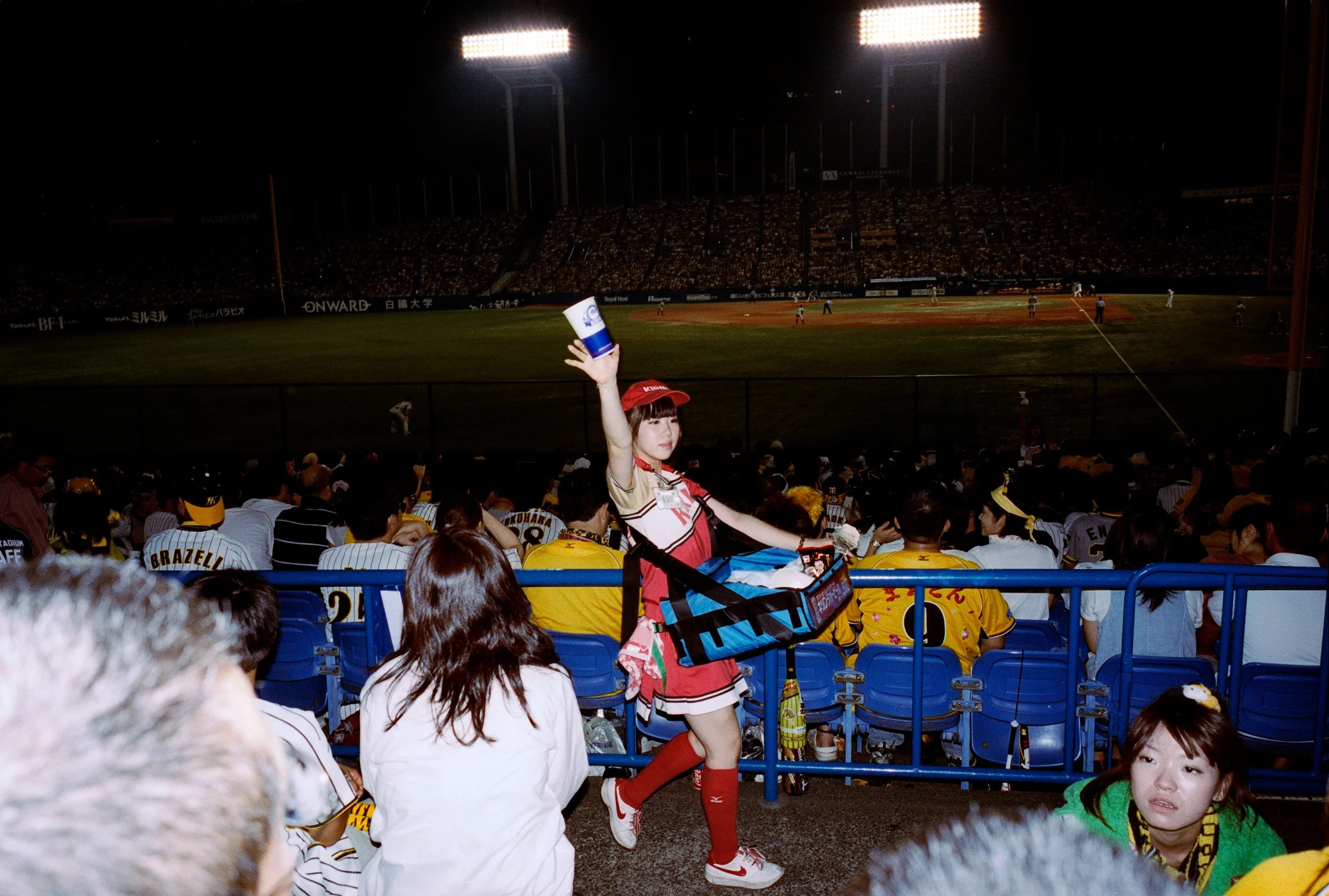 Documentary photograph taken by London based photographer Maxwell Anderson in Tokyo Japan at a baseball yakyu game between Tokyo Swallows and Hanshin Tigers of Osaka