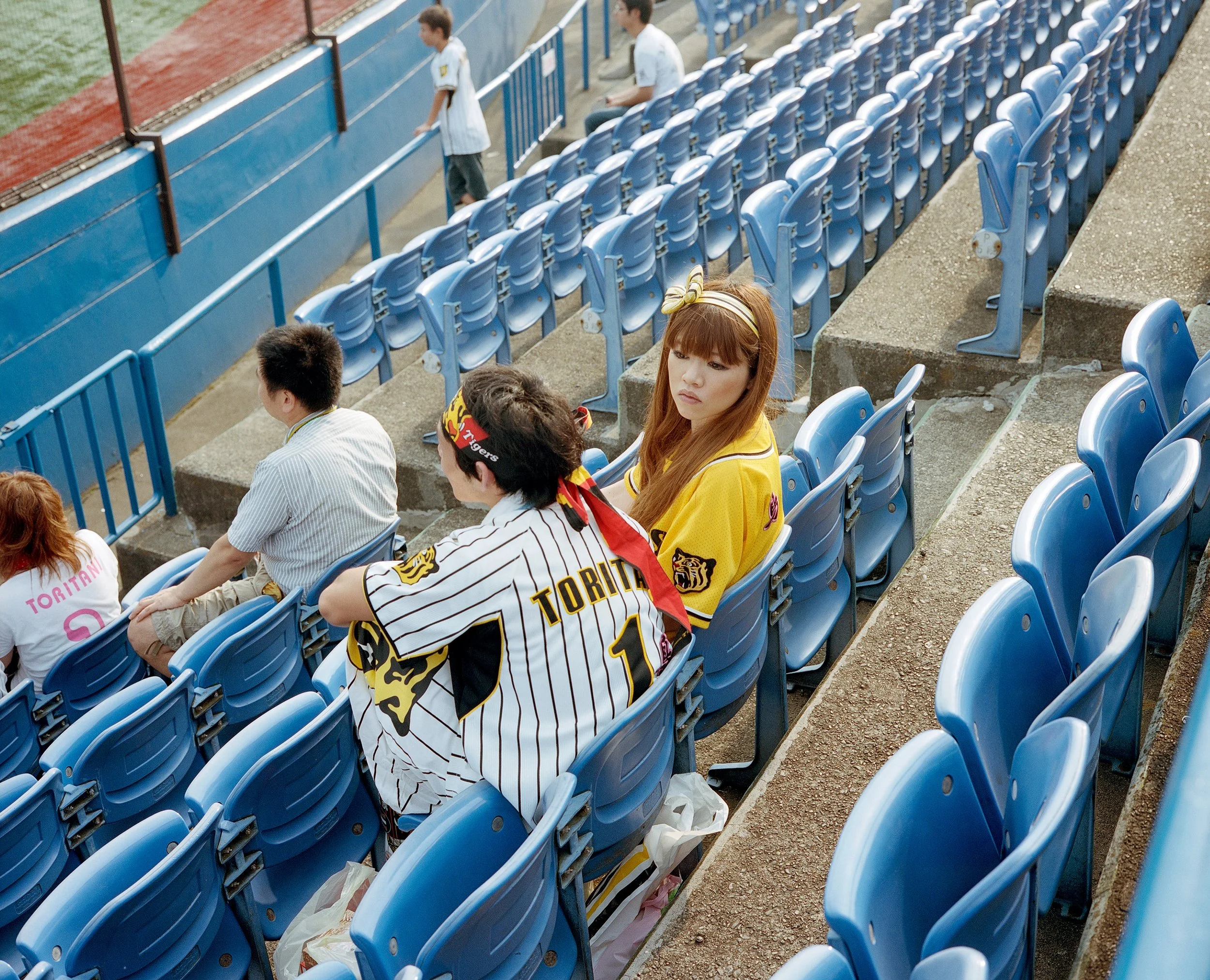 Documentary photograph taken by London based photographer Maxwell Anderson in Tokyo Japan at a baseball yakyu game between Tokyo Swallows and Hanshin Tigers of Osaka