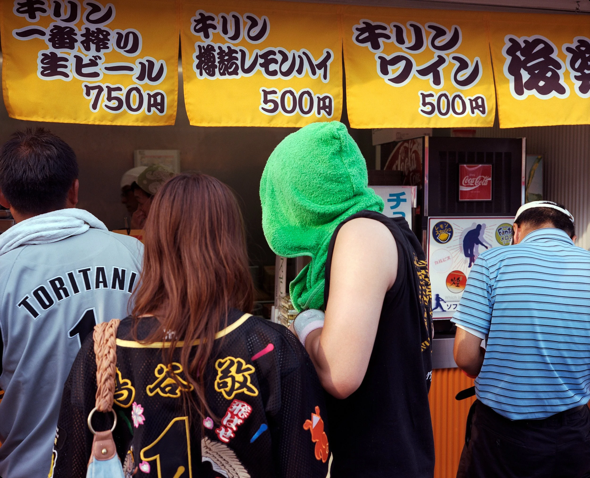 Documentary photograph taken by London based photographer Maxwell Anderson in Tokyo Japan at a baseball yakyu game between Tokyo Swallows and Hanshin Tigers of Osaka