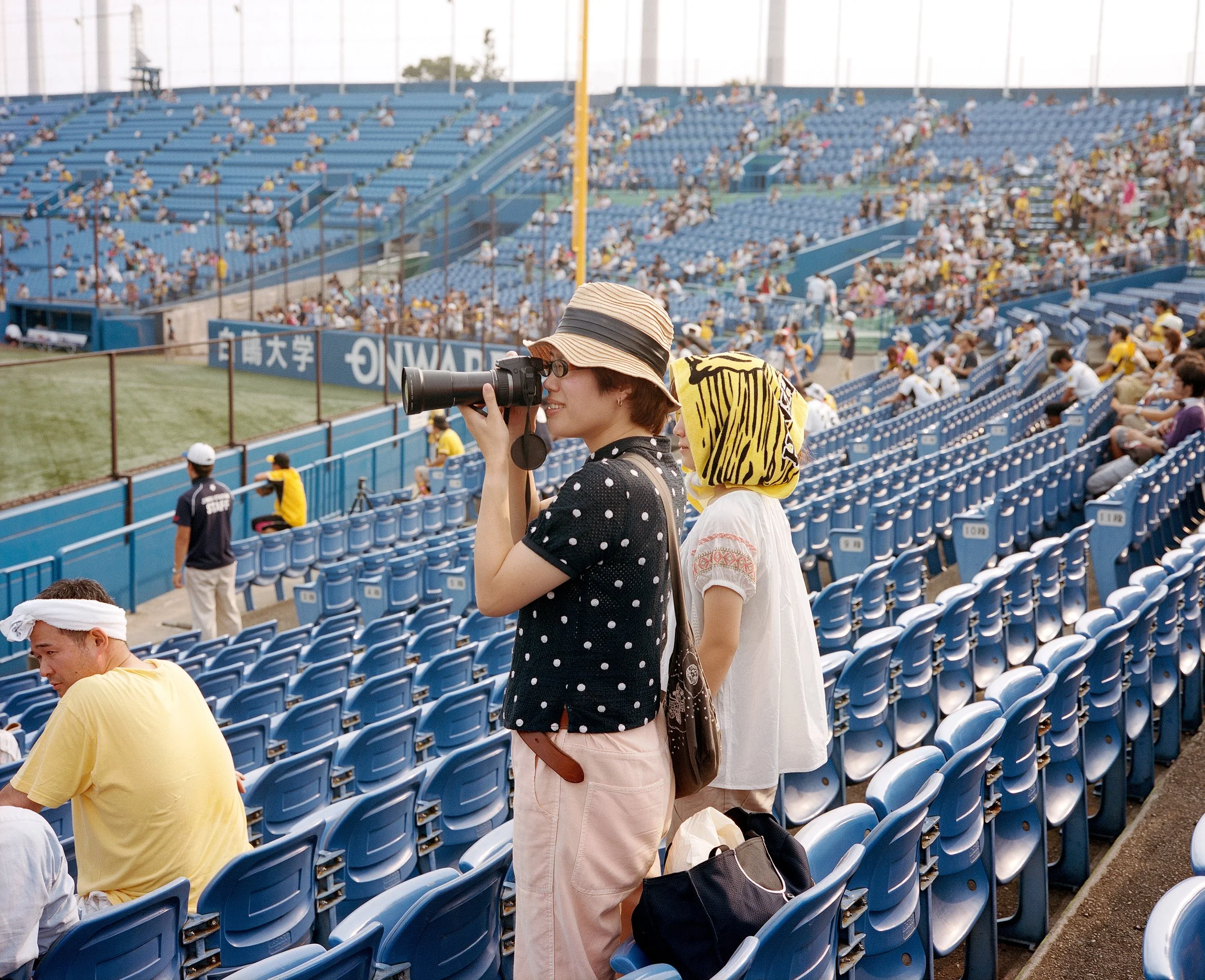Documentary photograph taken by London based photographer Maxwell Anderson in Tokyo Japan at a baseball yakyu game between Tokyo Swallows and Hanshin Tigers of Osaka