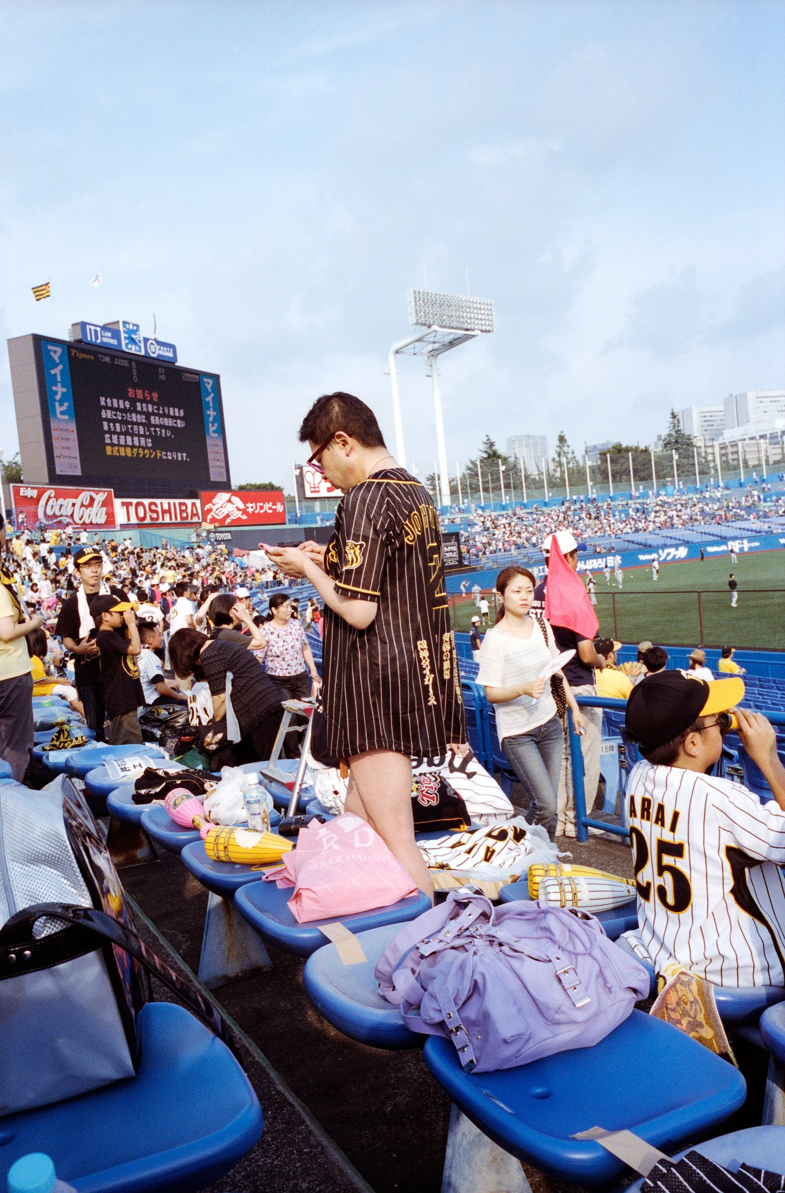 Documentary photograph taken by London based photographer Maxwell Anderson in Tokyo Japan at a baseball yakyu game between Tokyo Swallows and Hanshin Tigers of Osaka
