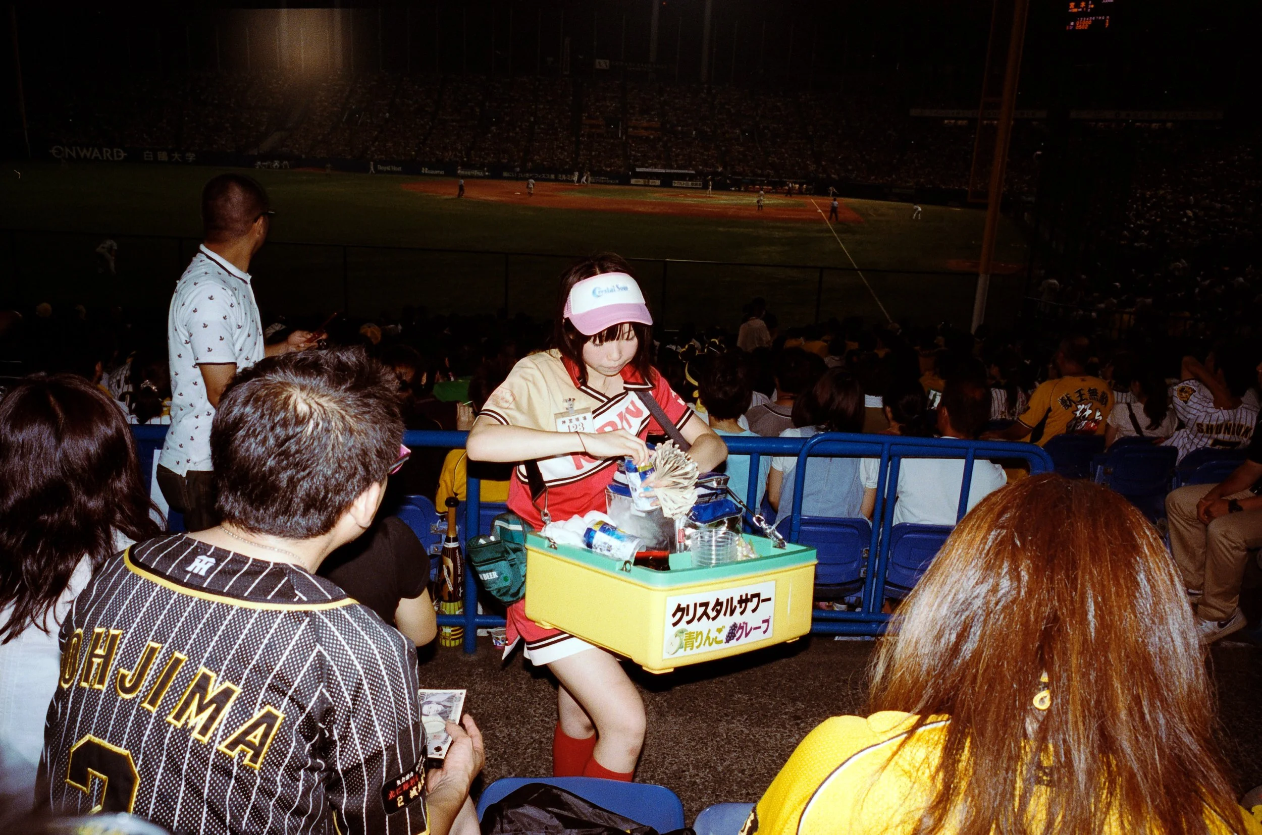 Documentary photograph taken by London based photographer Maxwell Anderson in Tokyo Japan at a baseball yakyu game between Tokyo Swallows and Hanshin Tigers of Osaka