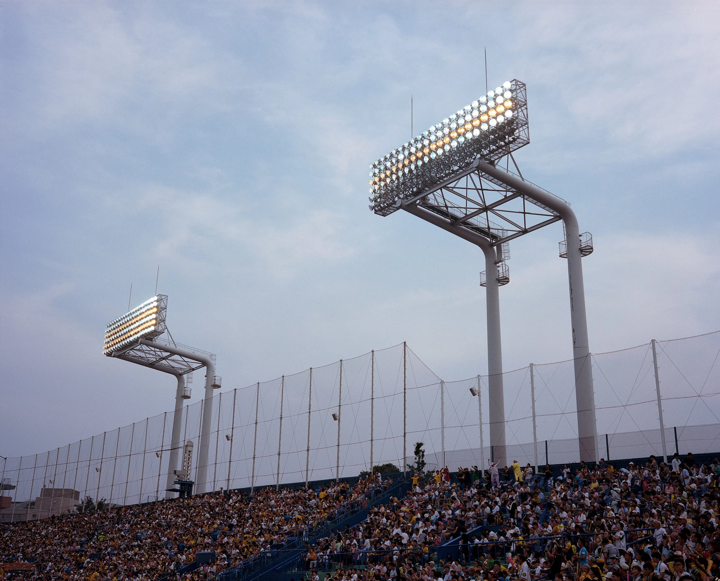Documentary photograph taken by London based photographer Maxwell Anderson in Tokyo Japan at a baseball yakyu game between Tokyo Swallows and Hanshin Tigers of Osaka