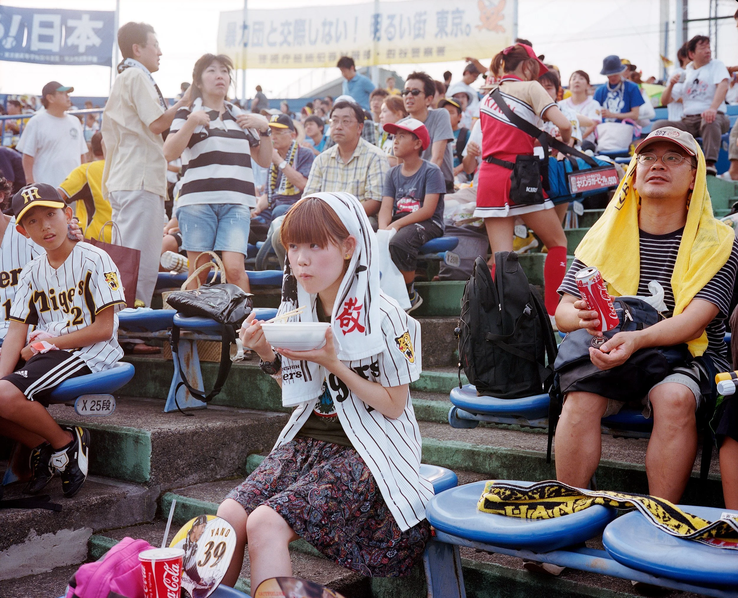 Documentary photograph taken by London based photographer Maxwell Anderson in Tokyo Japan at a baseball yakyu game between Tokyo Swallows and Hanshin Tigers of Osaka