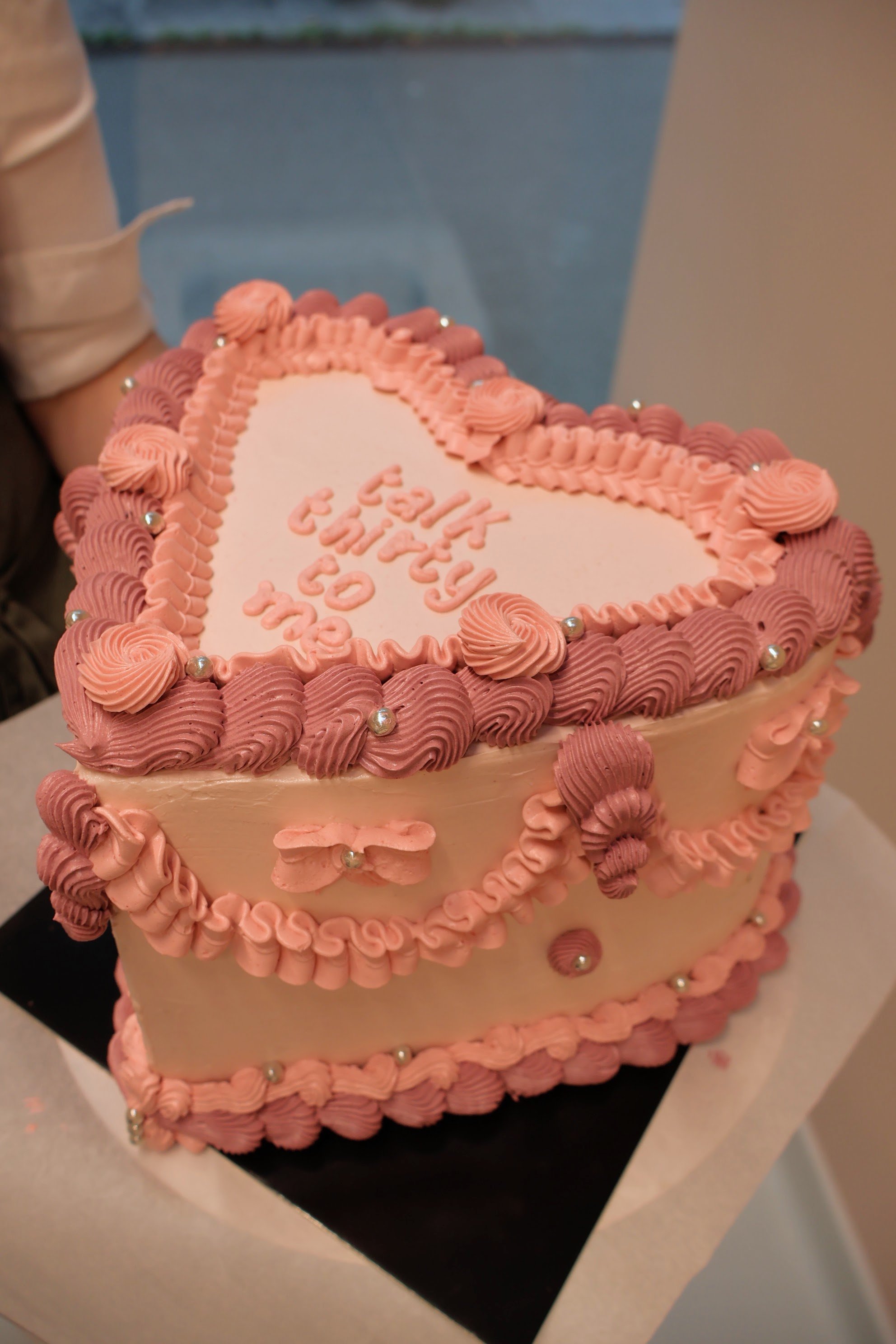 Heart shaped cake with vintage piping pearls and bows