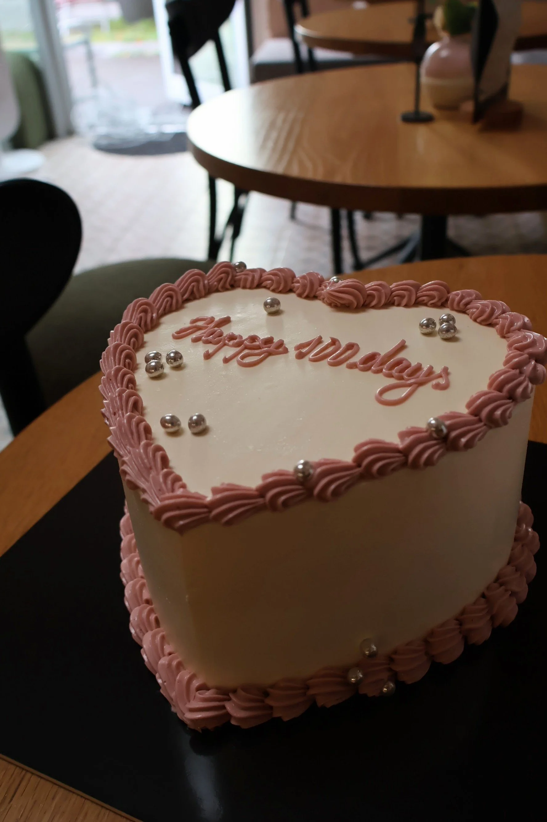 Custom cake decorated with vintage piping and pearls