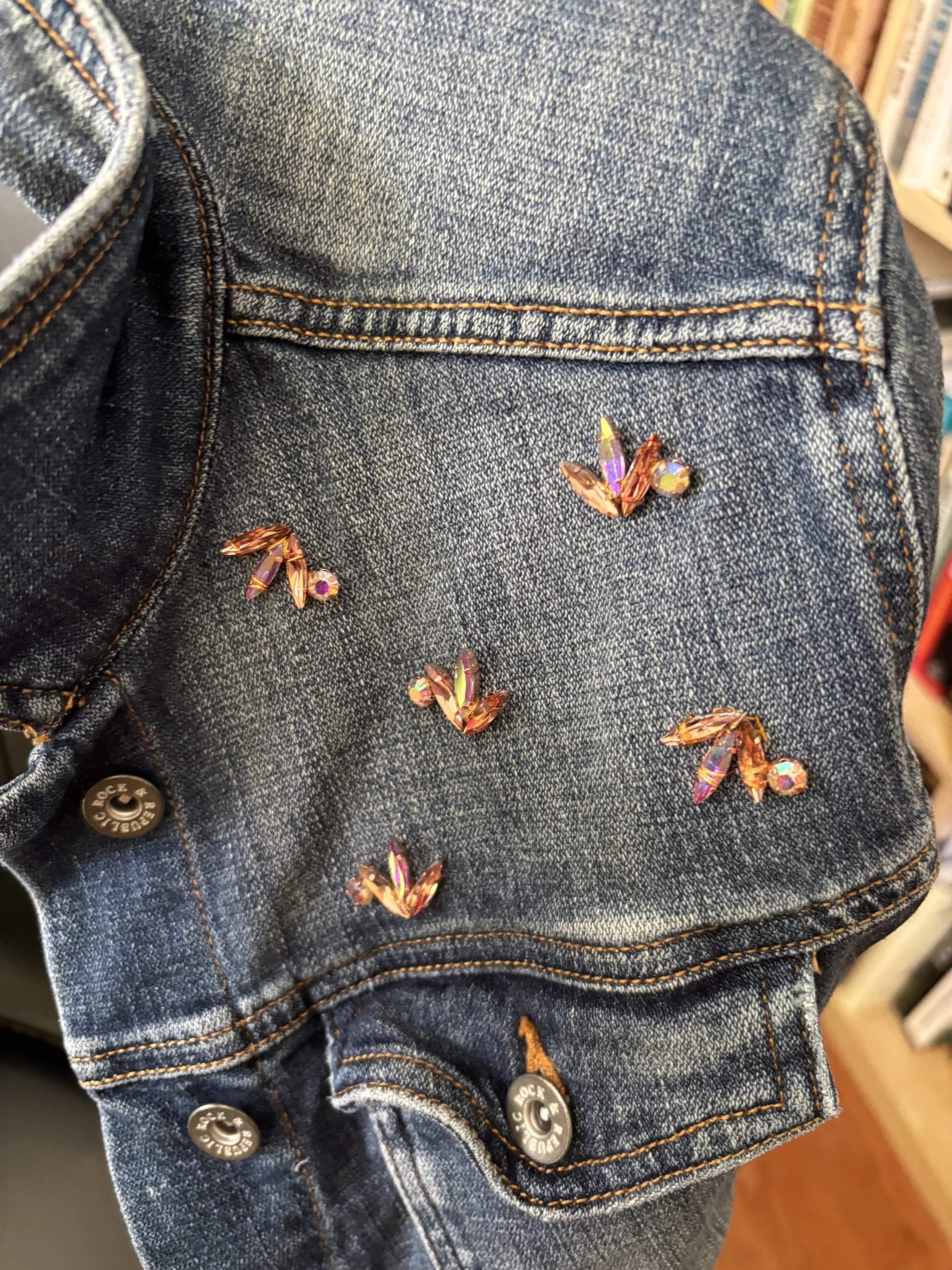 detail of rhinestone on left shoulder