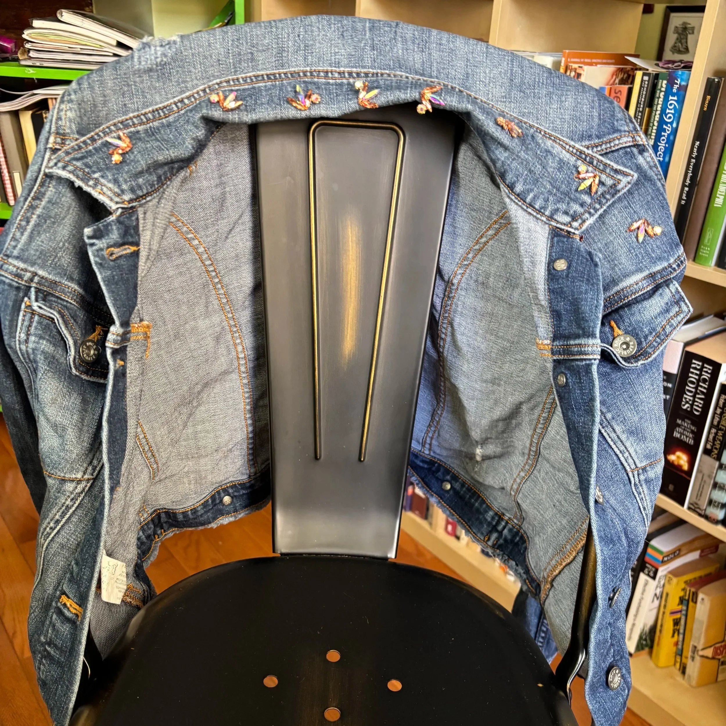 jean jacket with rhinestones on collar and left shoulder