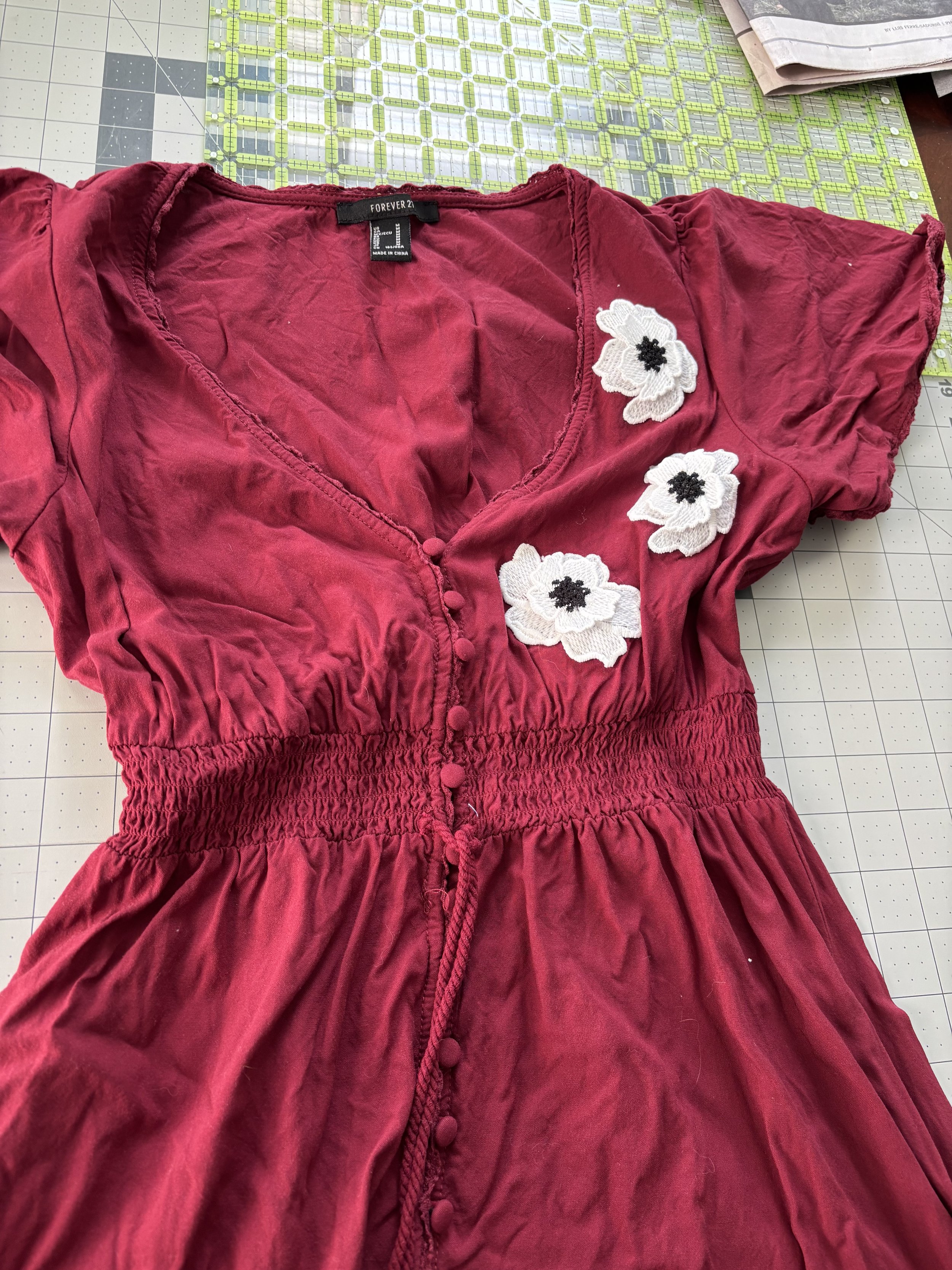 up cycled maroon dress with appliquéd white & black flowers
