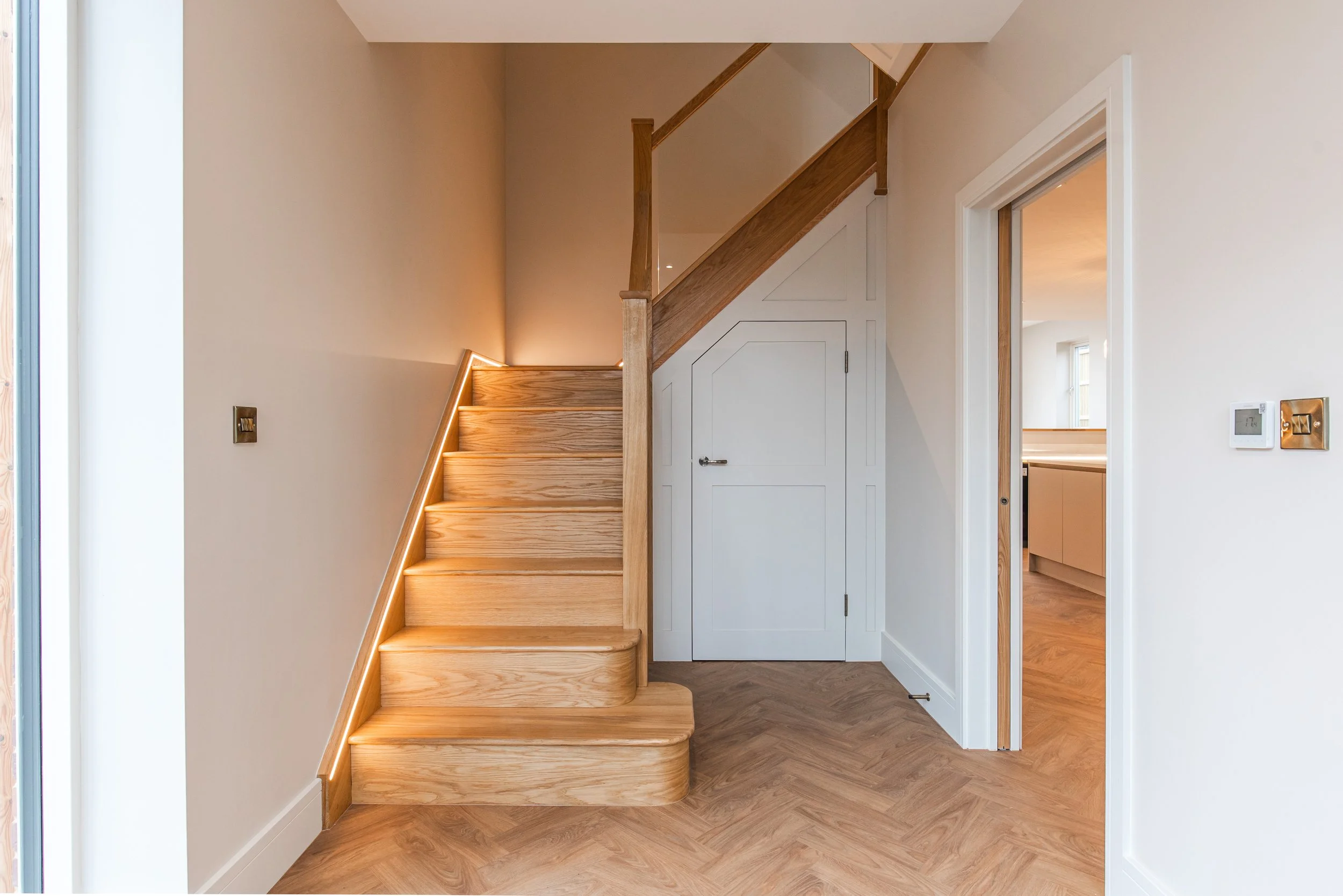 Entrance Hall with bespoke Oak Staircase and LED lighting.