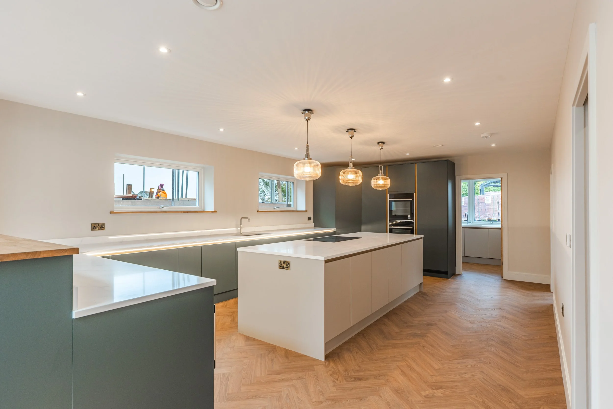 A view across the two-tone Masterclass kitchen with centre island.