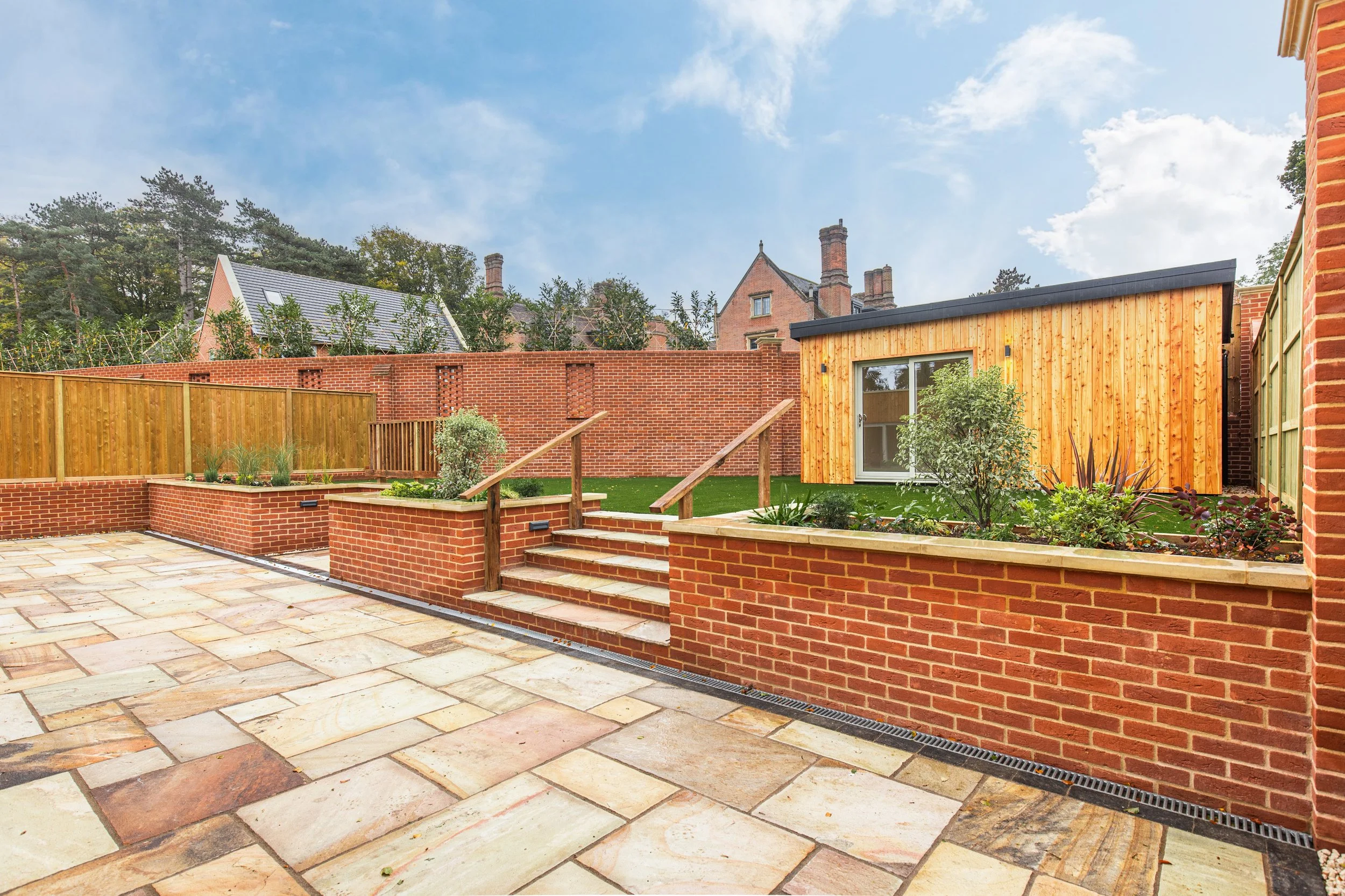 Split level garden, south-facing with bespoke garden room.