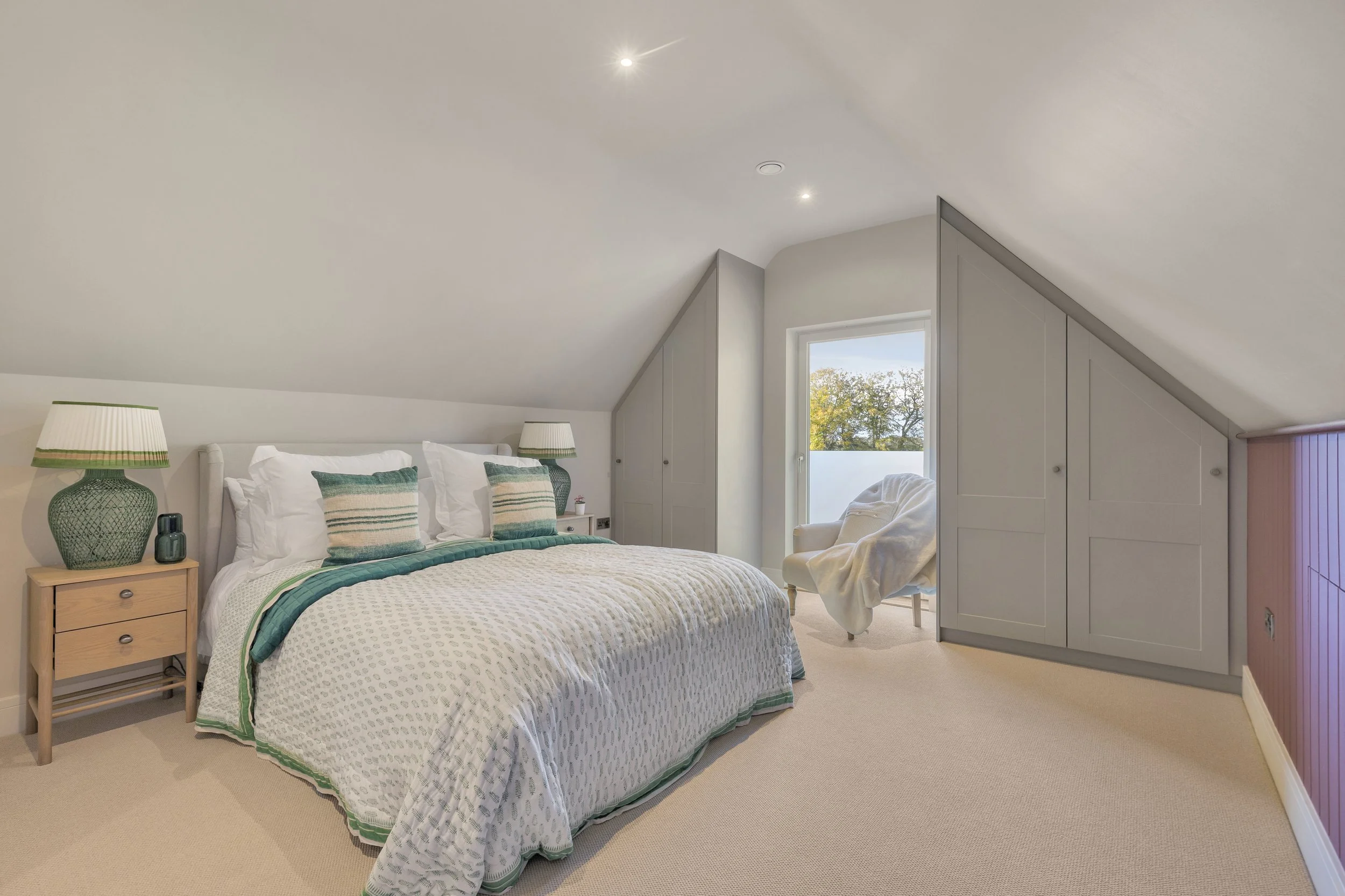 Rear bedroom with bespoke double wardrobes and Juliet Balcony detail.
