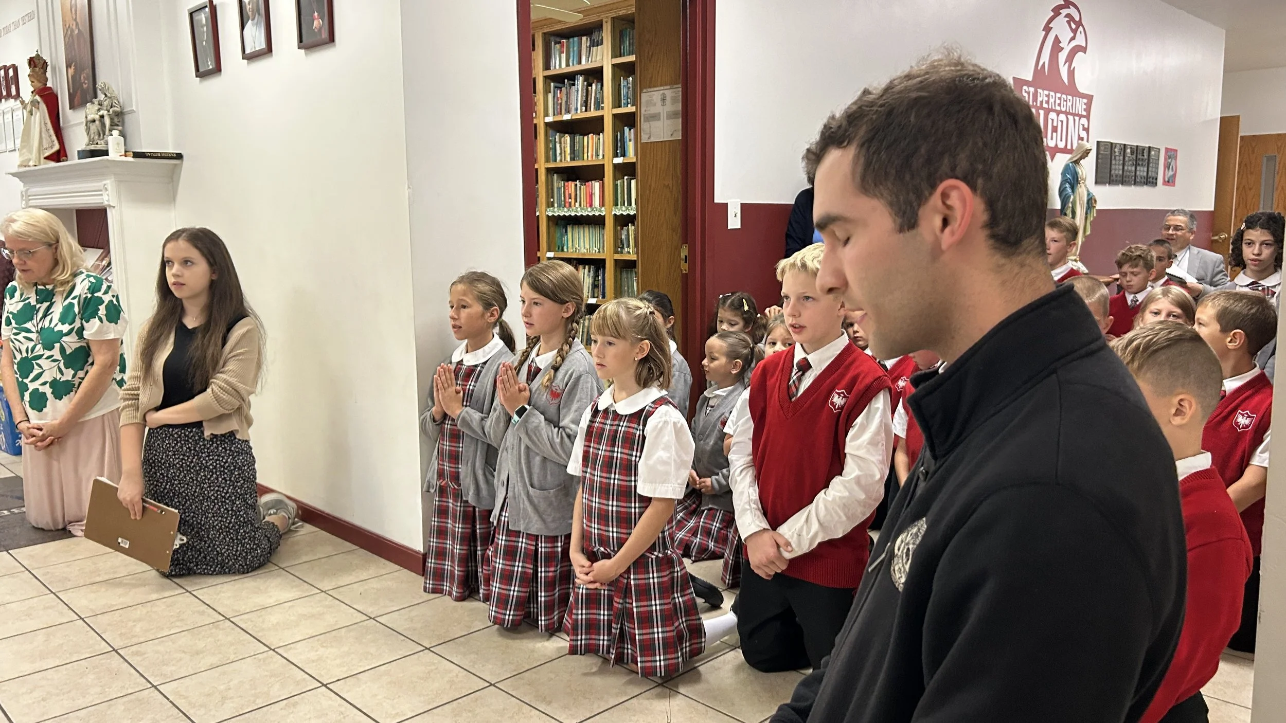 OCEN - St Peregrine Charter Day (08.2026)-IMG_7322-students praying.jpg