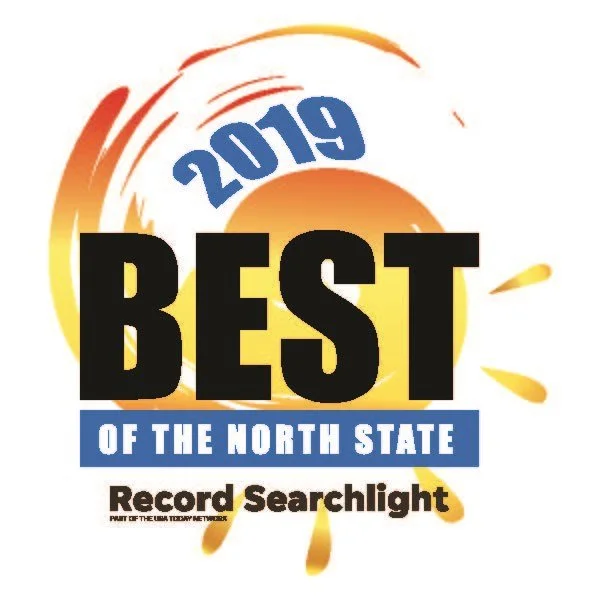 2021 Best of the North State Record Searchlight award logo with a stylized sun and orange background.